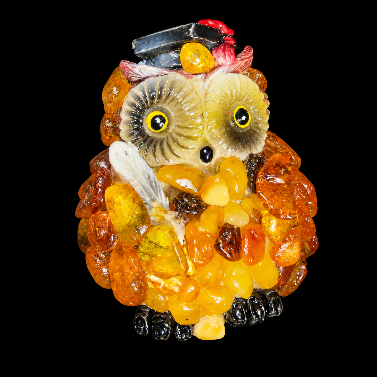 Made in USA natural Baltic amber graduation owl fridge magnet with black cap and white quill, black background
