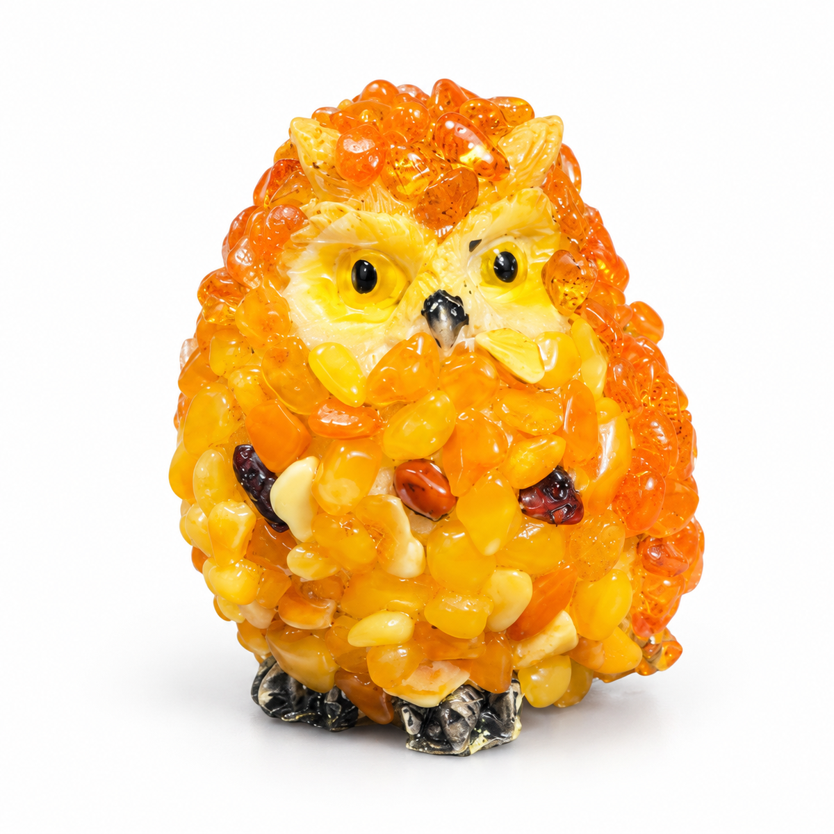 Orange and yellow owl figurine on a white background