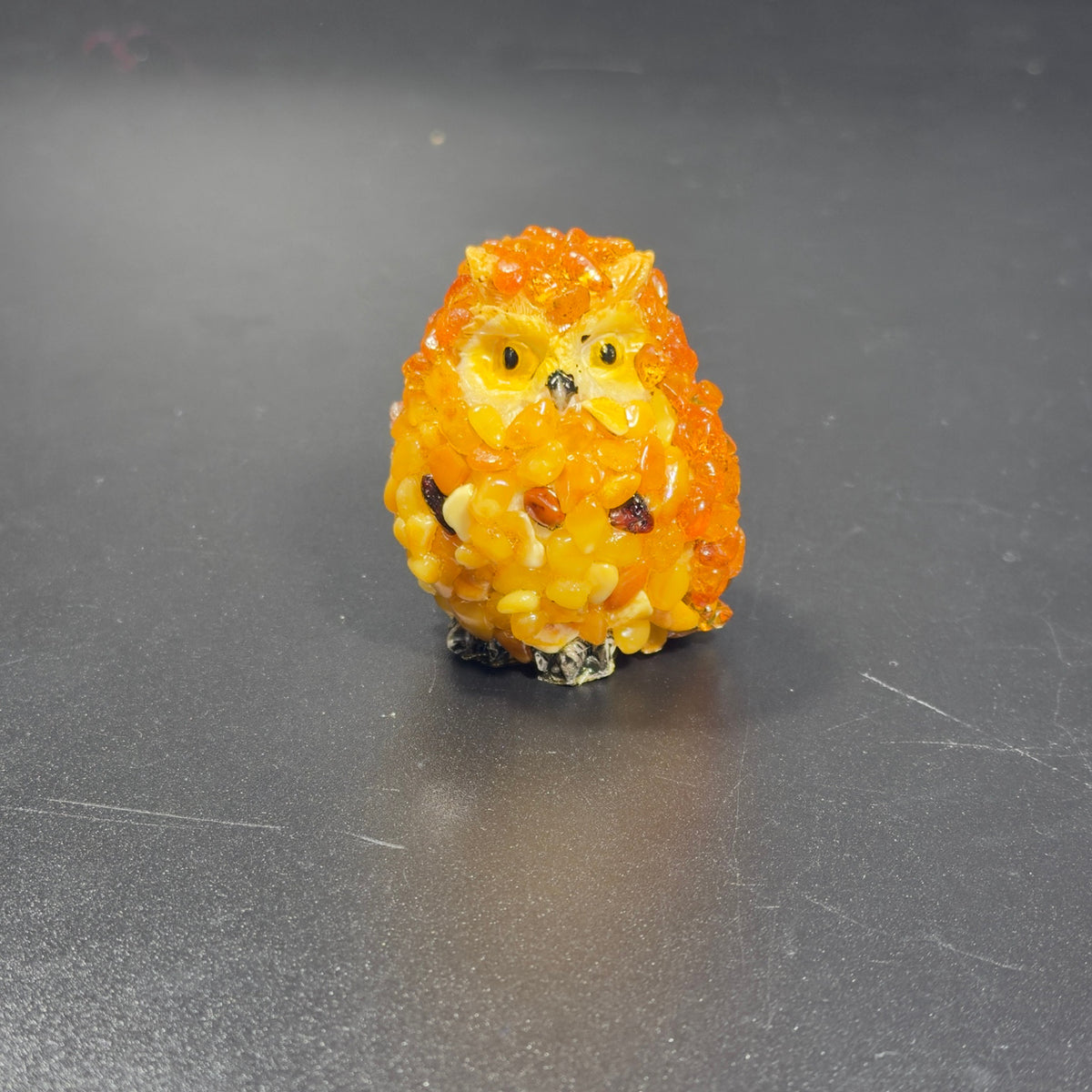 Original front photograph of the orange and yellow owl figurine