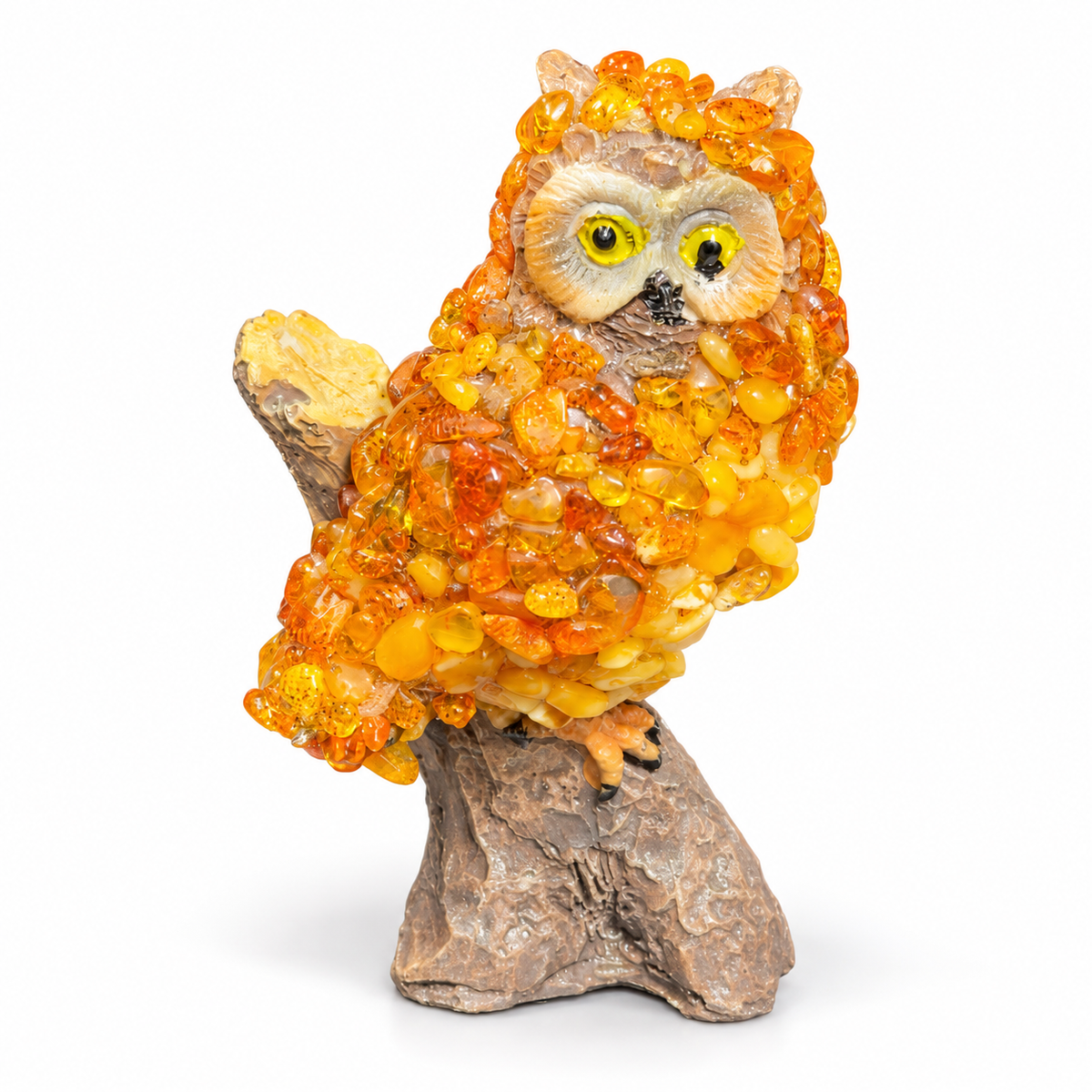 Golden orange owl figurine with textured chip decoration on a white studio background