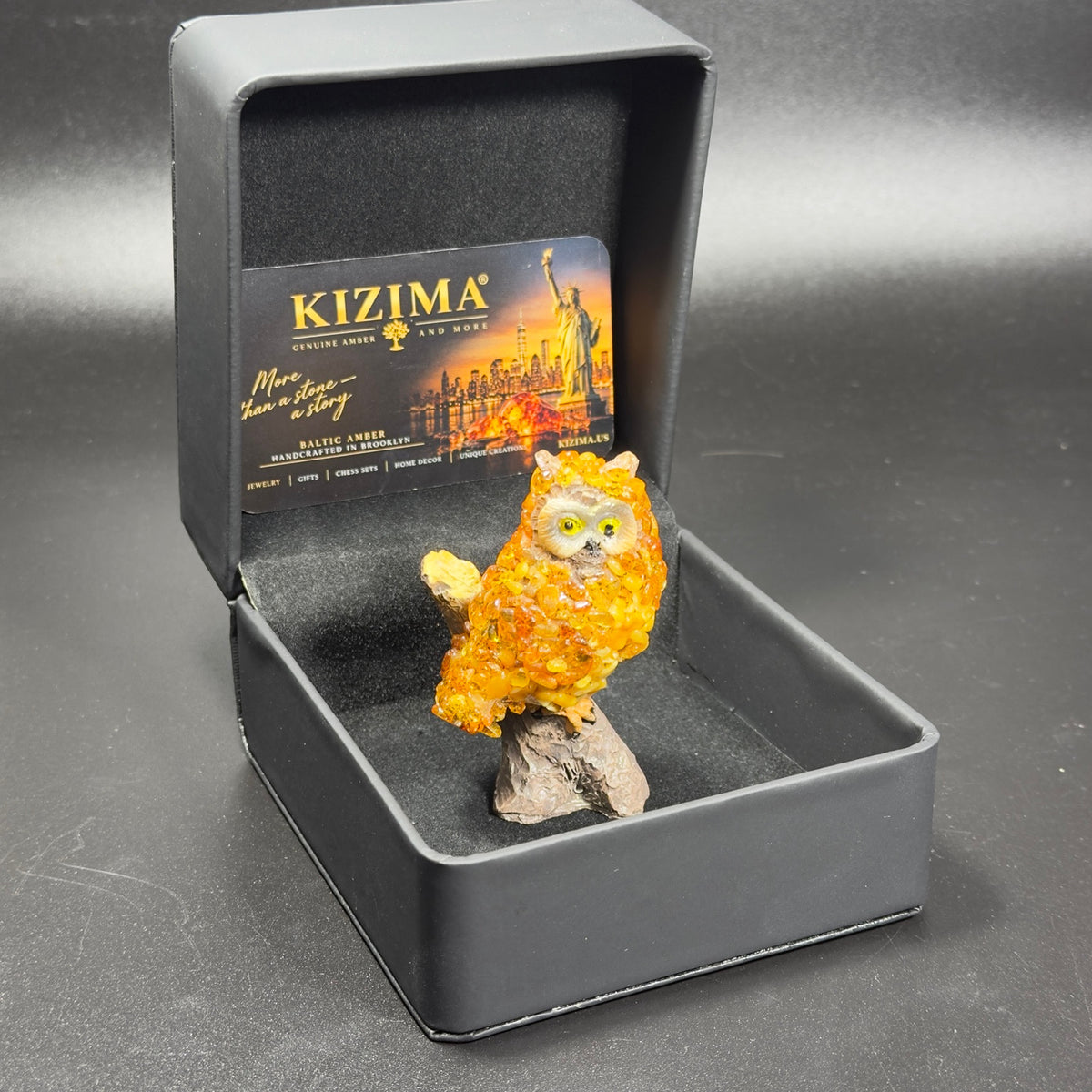 Original unedited owner photo of the owl figurine inside its KIZIMA box