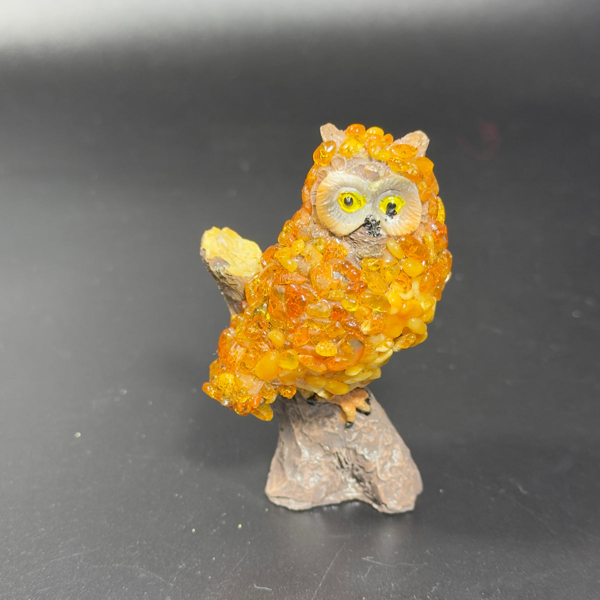 Original unedited owner photo of the golden orange owl figurine on its tree stump