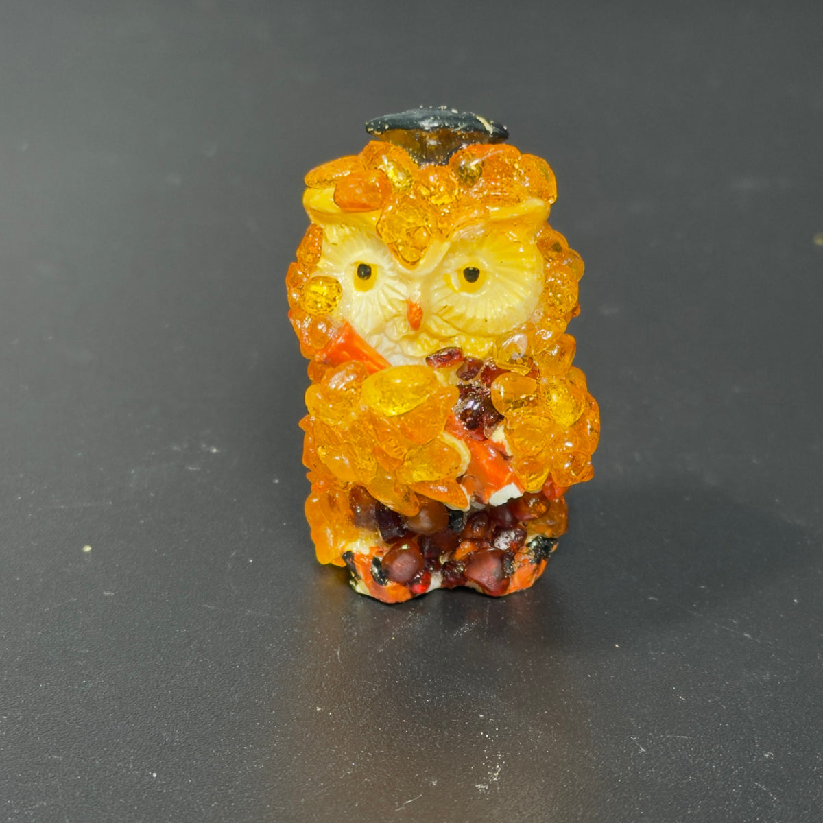 Original front photograph of the golden graduation owl figurine with a dark cap.