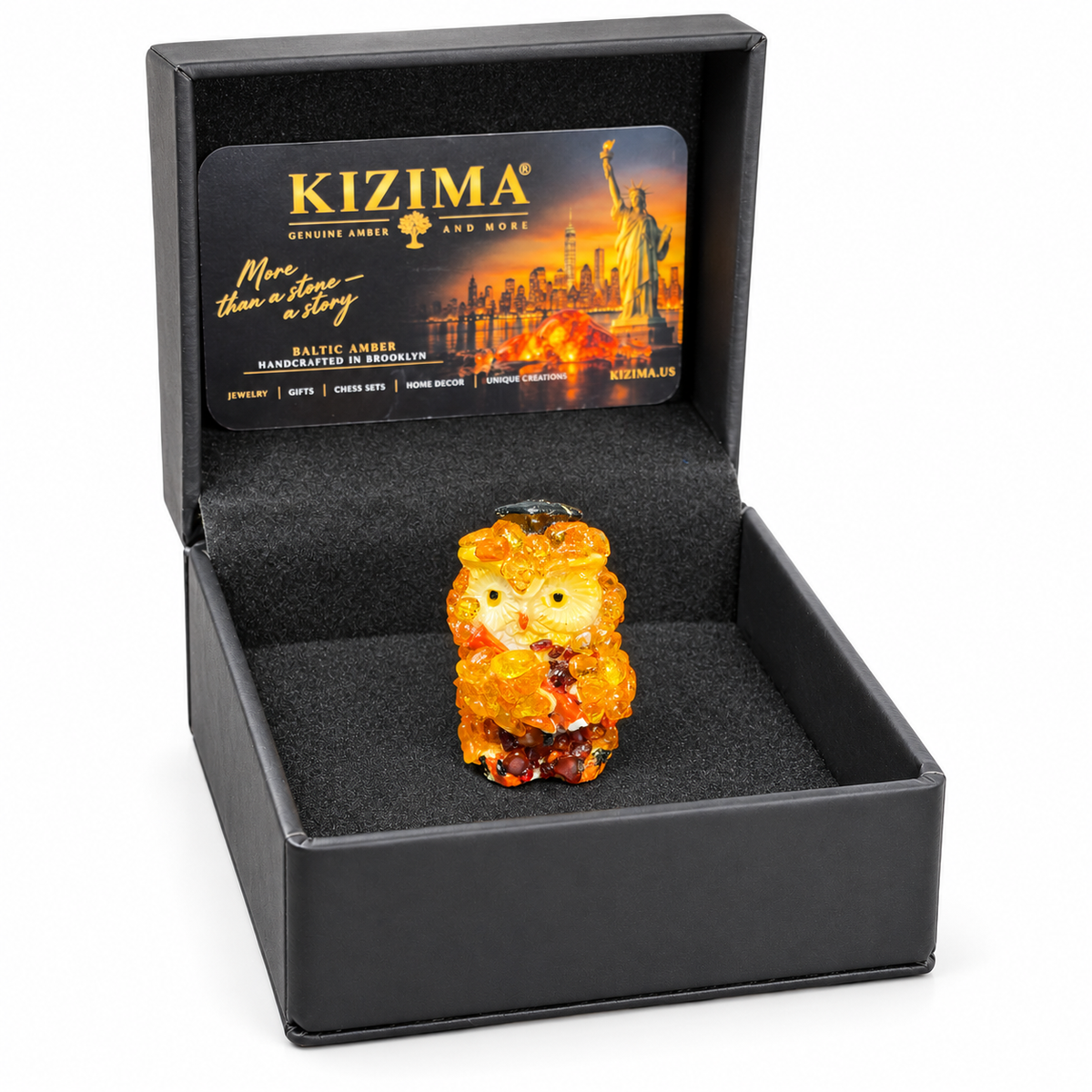 Miniature graduation owl figurine shown with its presentation packaging.