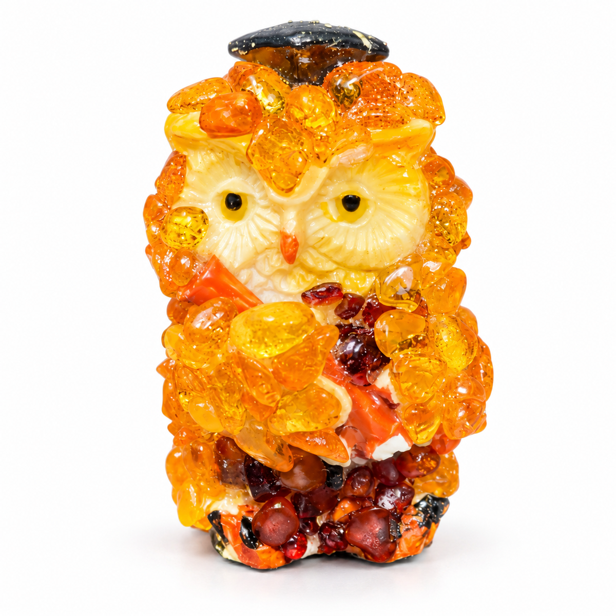Front view of the miniature graduation owl with yellow eyes on a white background.