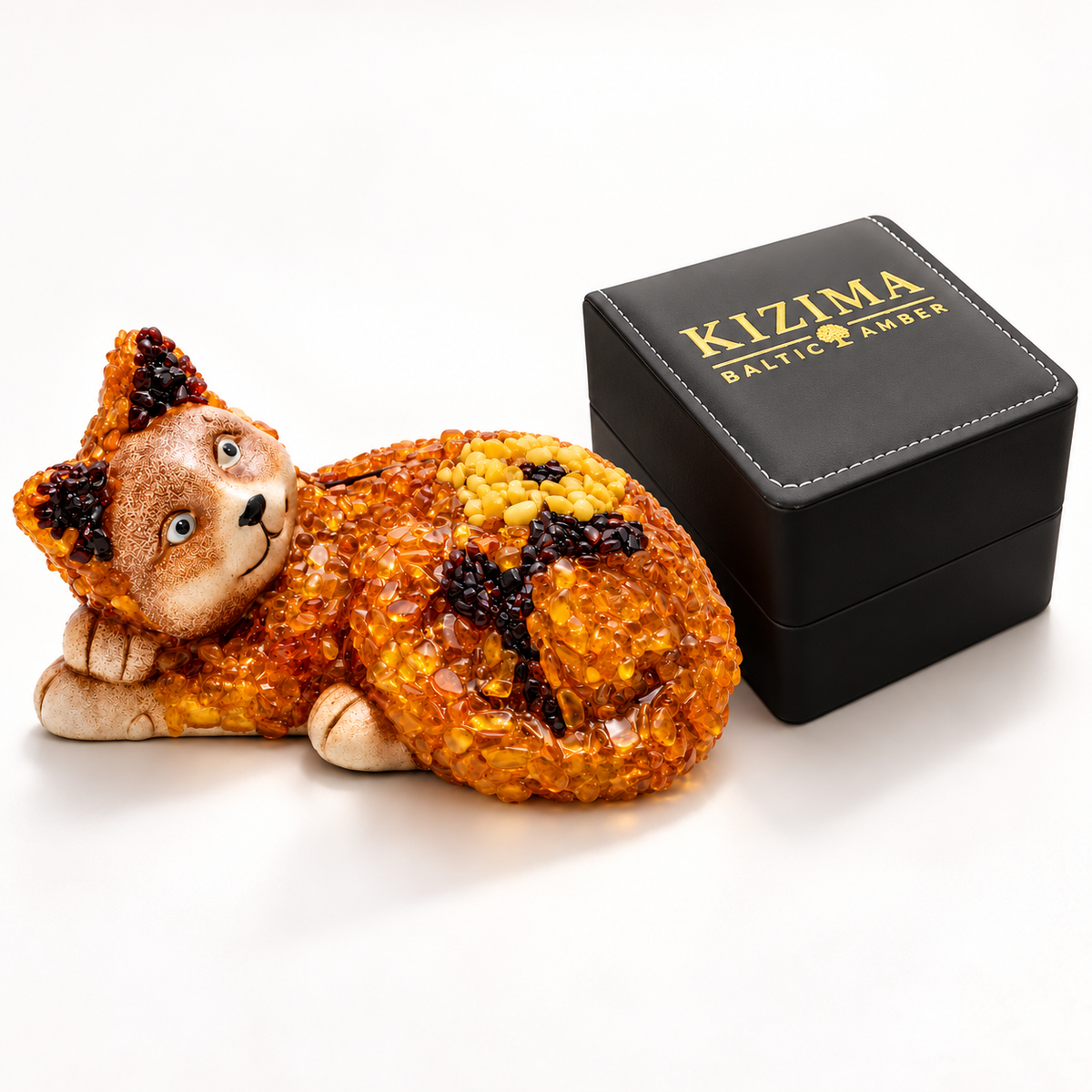KIZIMA cat figurine beside the actual black stitched branded gift box