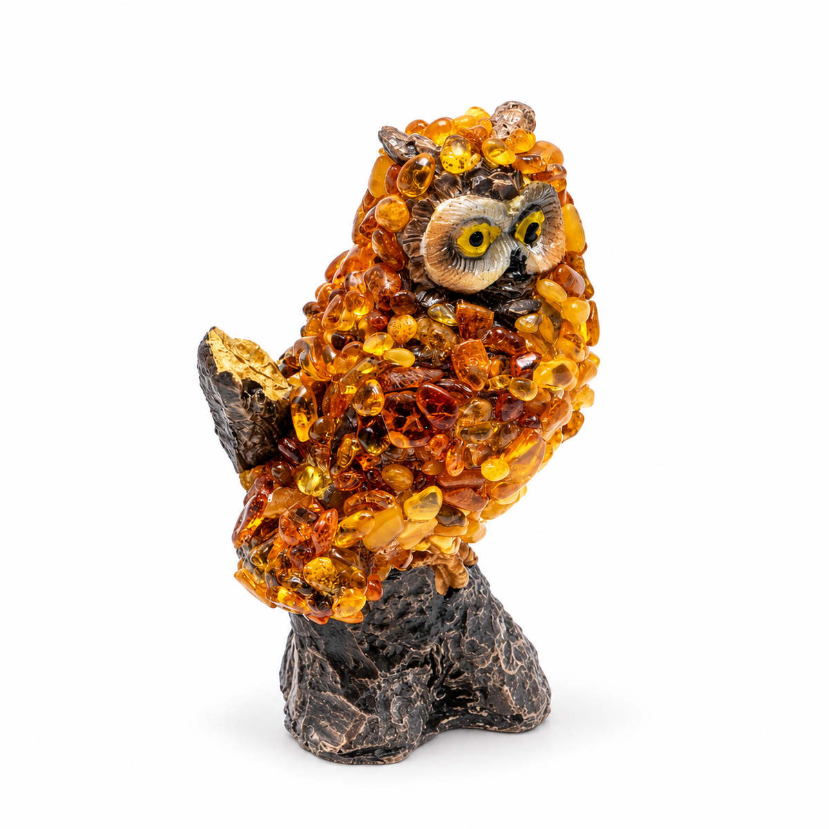 KIZIMA 5598742O amber owl on a tree branch, full oblique-front view on a white studio background.