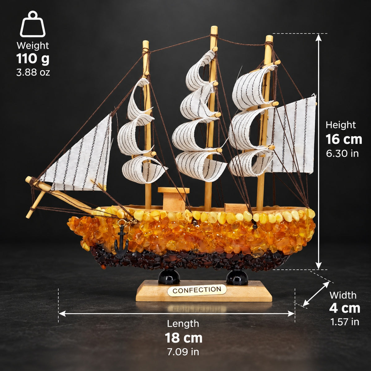 KIZIMA Sailing ship model 5599267 with dimensions and weight in metric and imperial units. Height 16 cm / 6.30 in; Length 18 cm / 7.09 in; Width 4 cm / 1.57 in; Weight 110 g / 3.88 oz.
