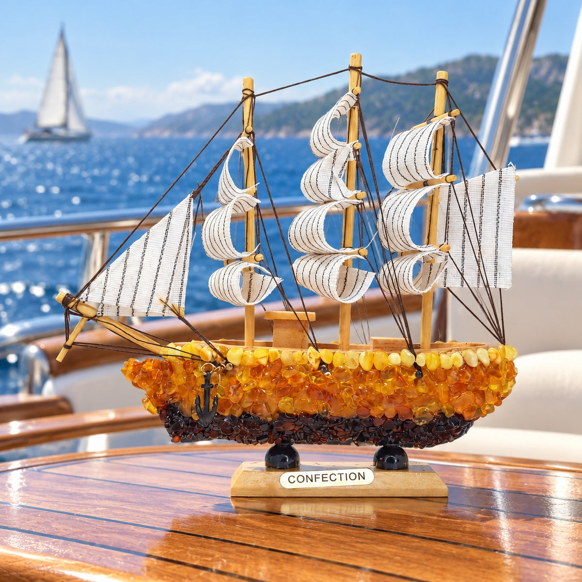 KIZIMA Sailing ship model 5599267 on a yacht table overlooking the sea.