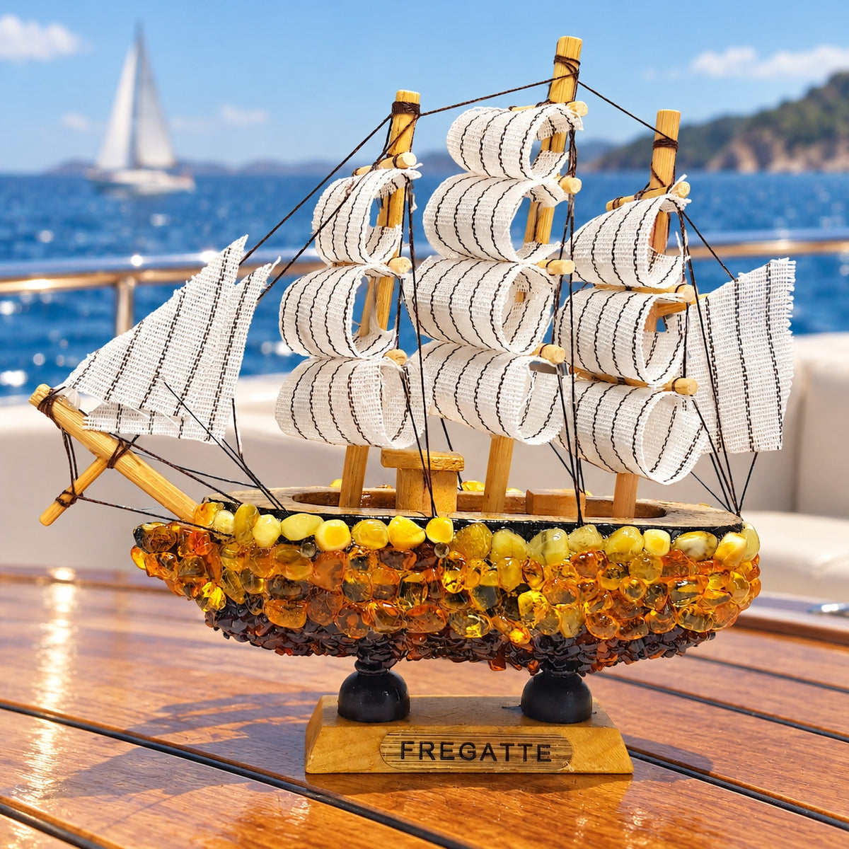 KIZIMA Frigate ship model 5599268 on a yacht table overlooking the sea.
