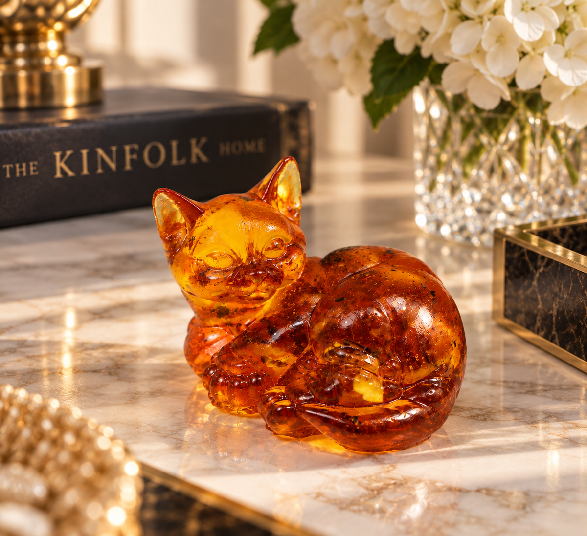 Made in USA Natural Baltic Amber Curled Cat Figurine by KIZIMA® — handmade amber cat sculpture, side view