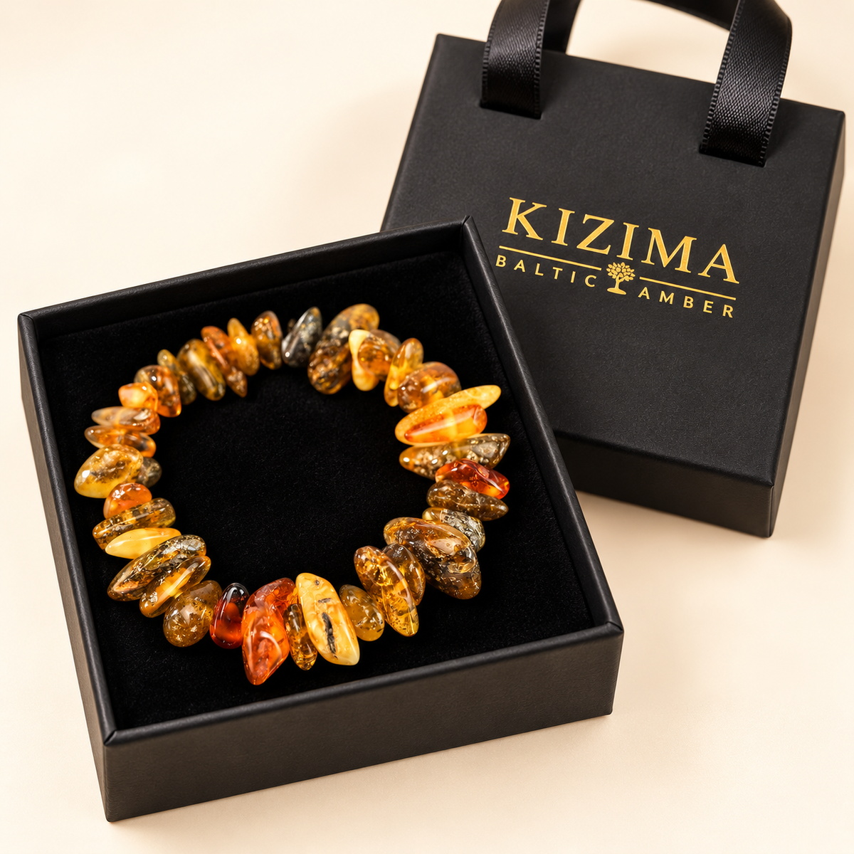 Multicolor amber nugget bracelet on clean black velvet in a KIZIMA gift box.