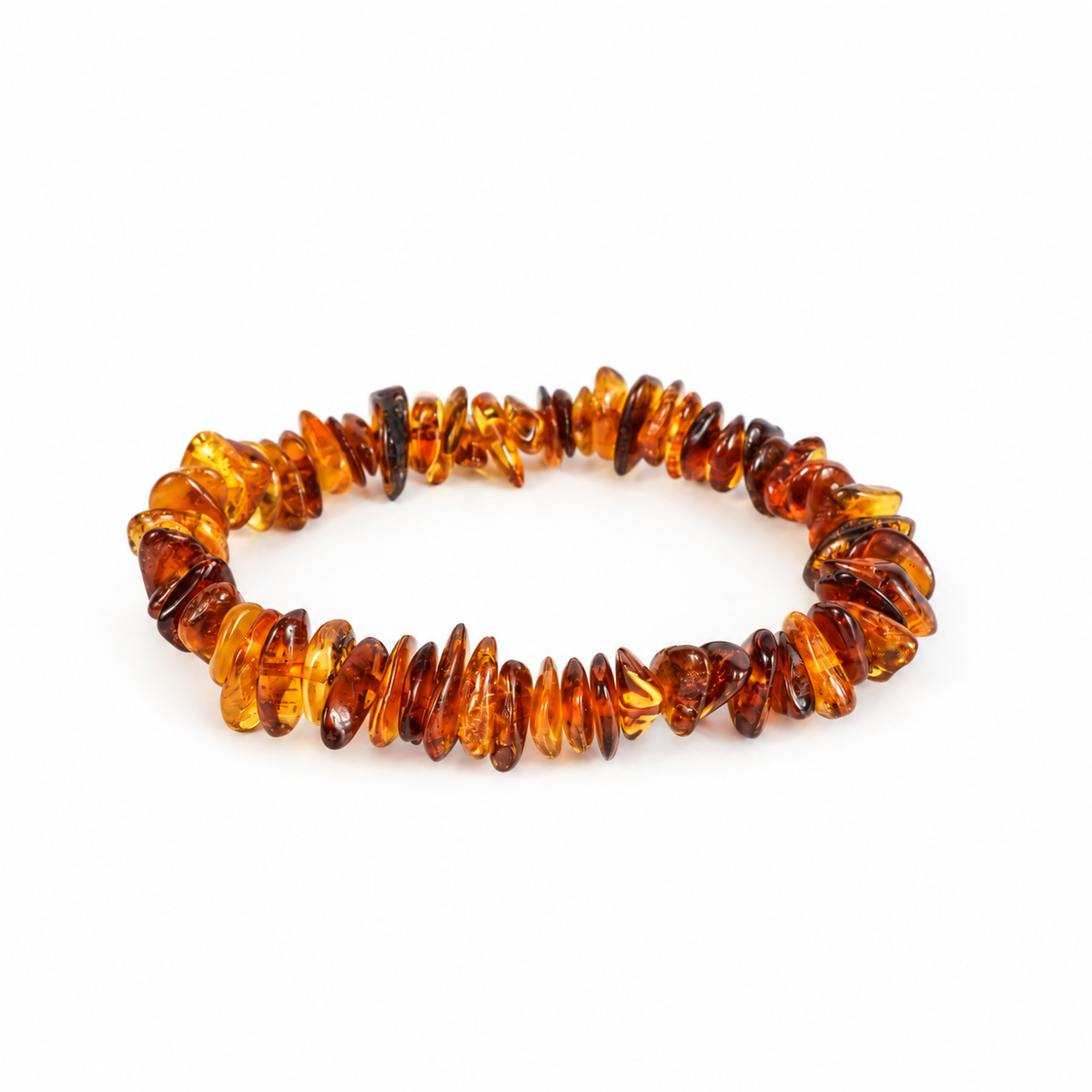 KIZIMA polished honey and cognac amber chip bracelet on a pure white background.