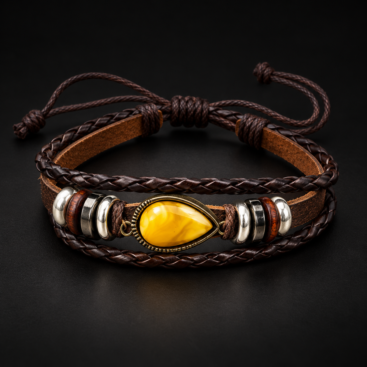 KIZIMA 662987478731 yellow amber teardrop multi-strand brown leather bracelet on a black studio background