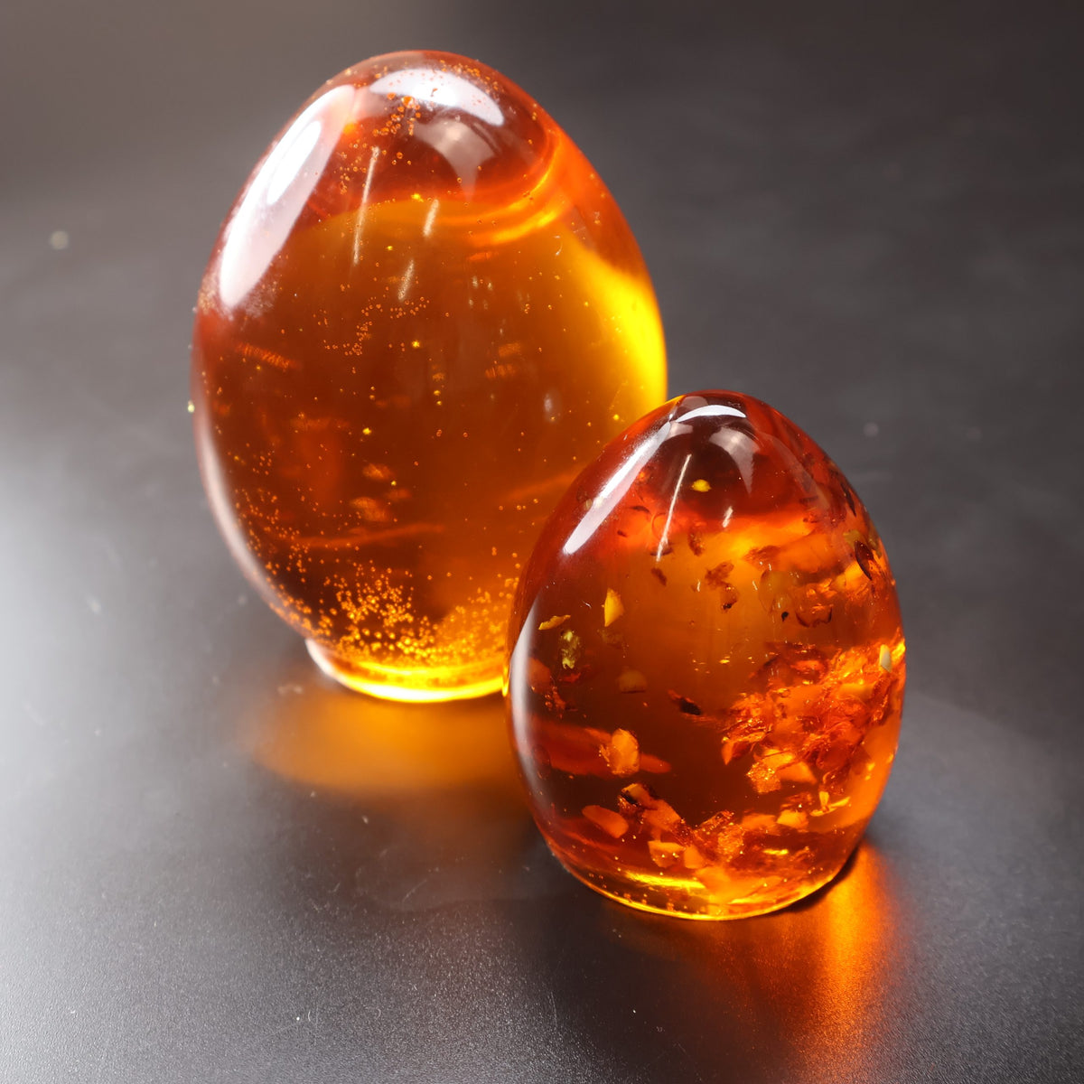 Handmade Baltic amber Easter eggs by KIZIMA® USA — natural amber decor, side view