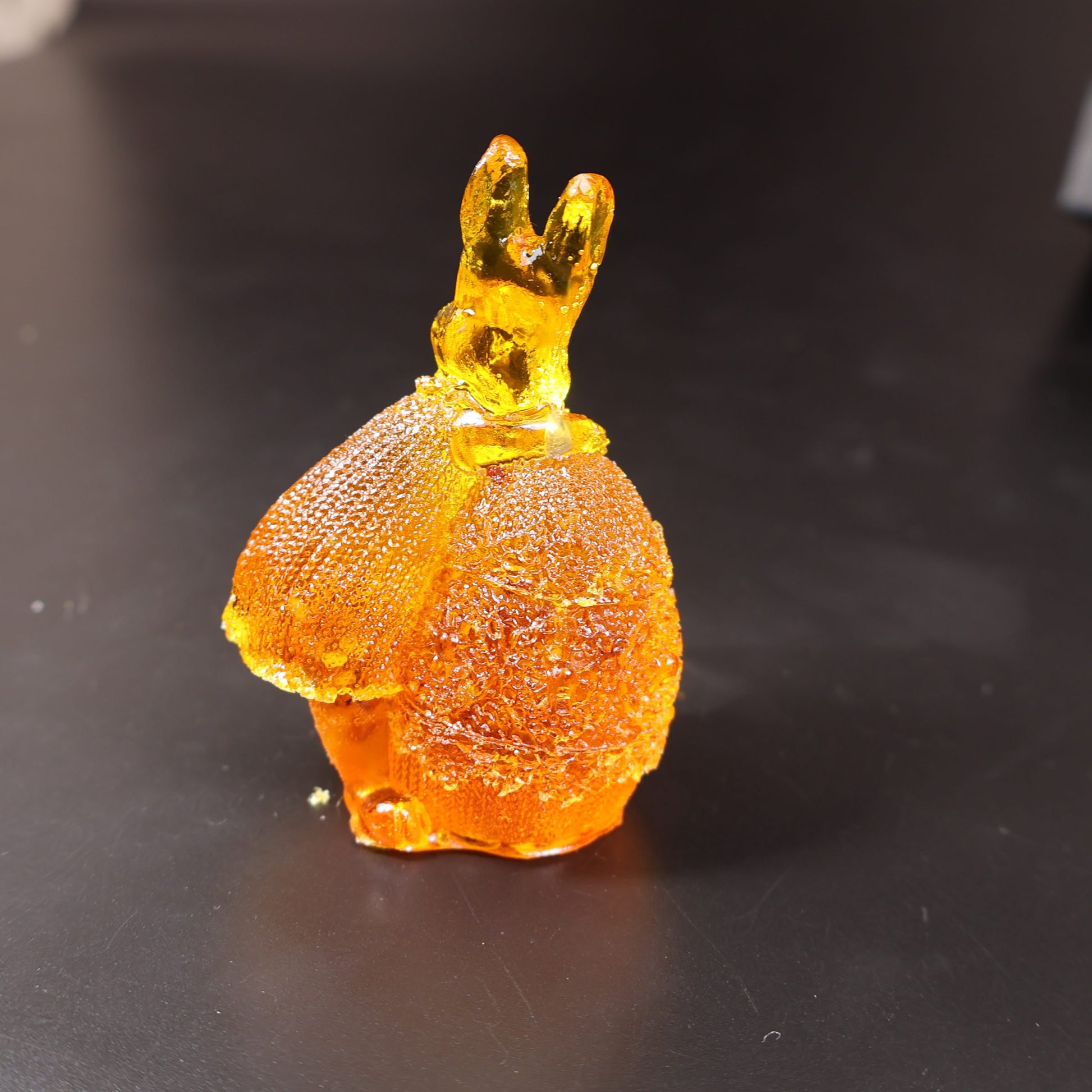 KIZIMA® amber bunny on egg figurine — genuine Baltic amber decor, made in USA, close-up
