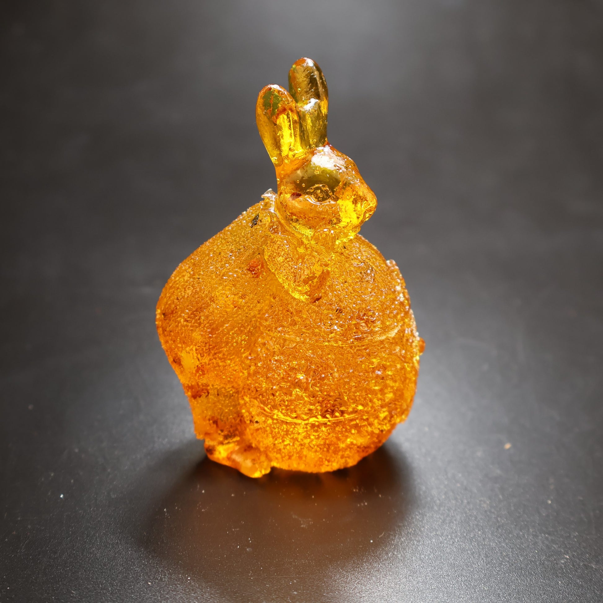 KIZIMA® amber bunny on egg — genuine Baltic amber decor, handmade in USA, angled detail
