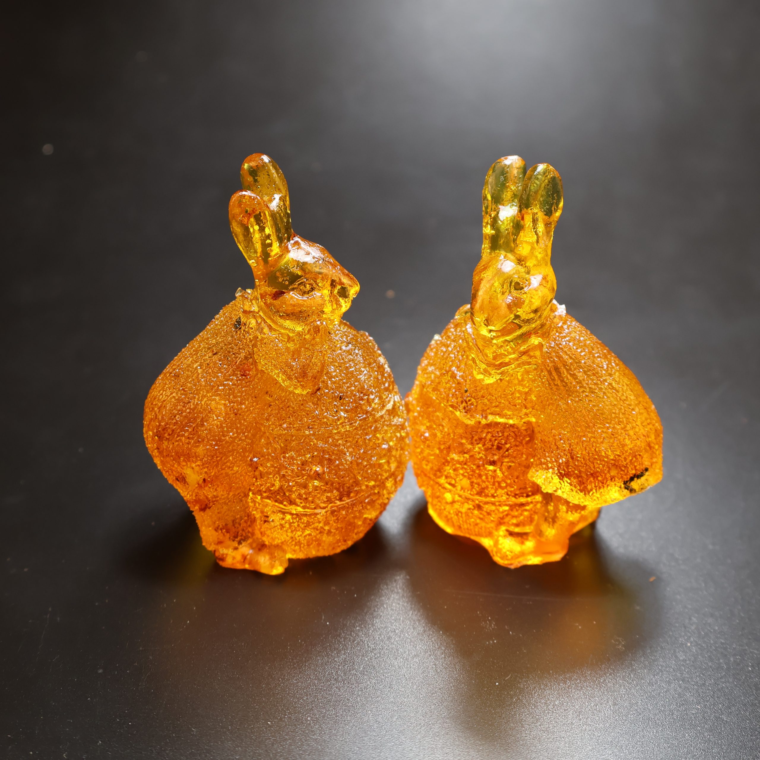 Bunny on egg Baltic amber figurine by KIZIMA® — genuine amber, handmade in USA, detail view