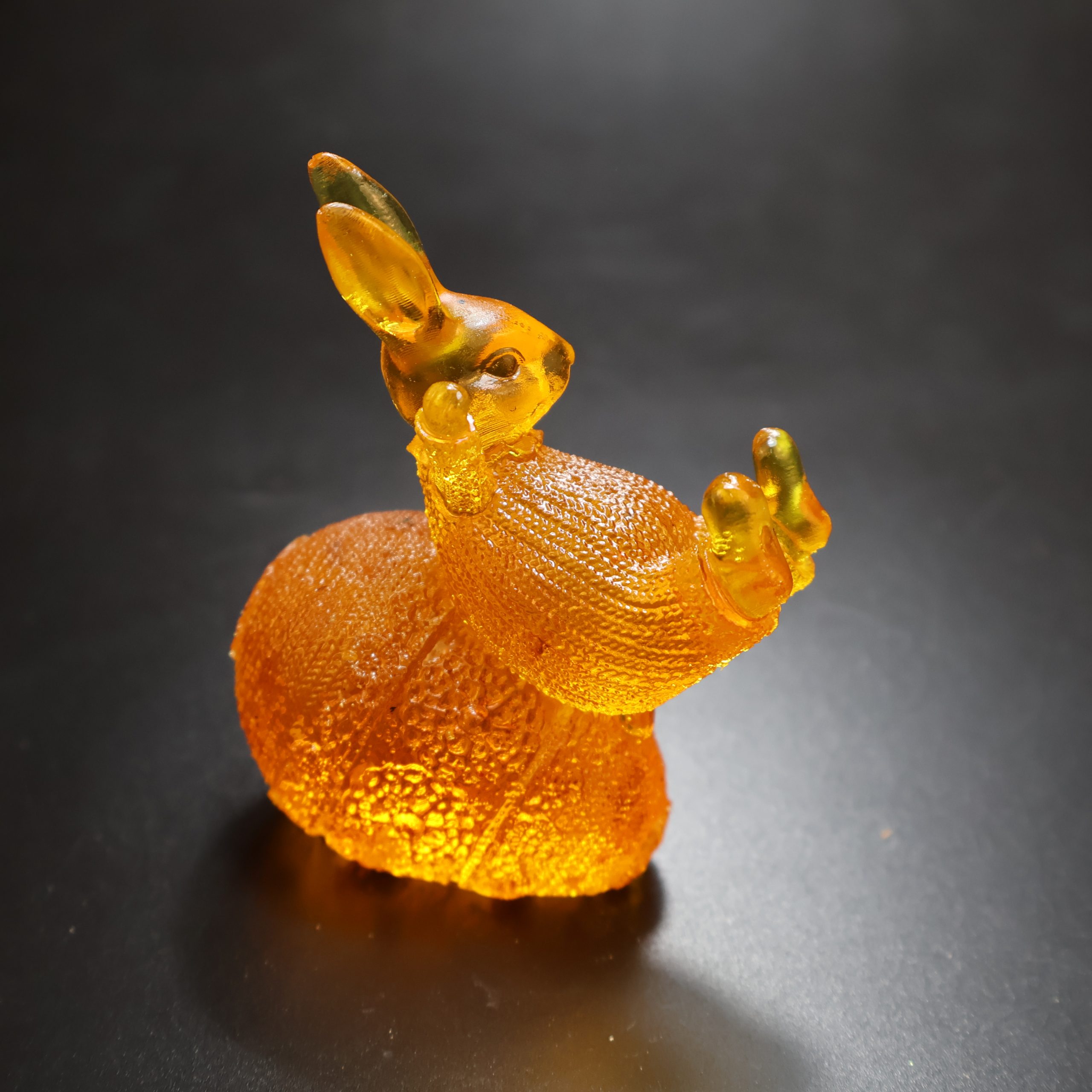 Baltic amber bunny on egg by KIZIMA® — genuine amber gift, handmade in USA, detail angle