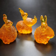 Bunny on egg Baltic amber figurine by KIZIMA® — genuine amber decor, handmade in USA, detail view