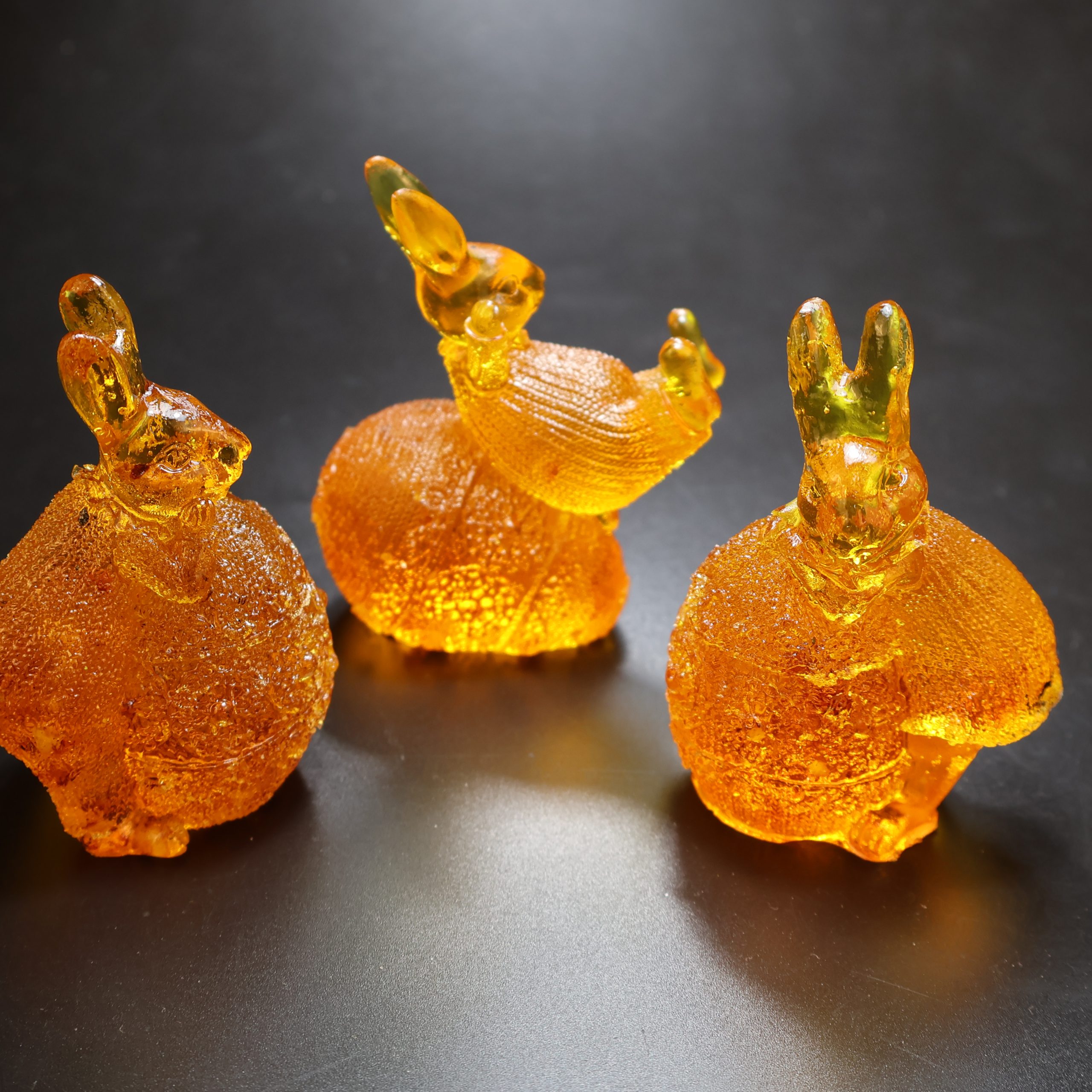 Bunny on egg Baltic amber figurine by KIZIMA® — genuine amber decor, handmade in USA, detail view
