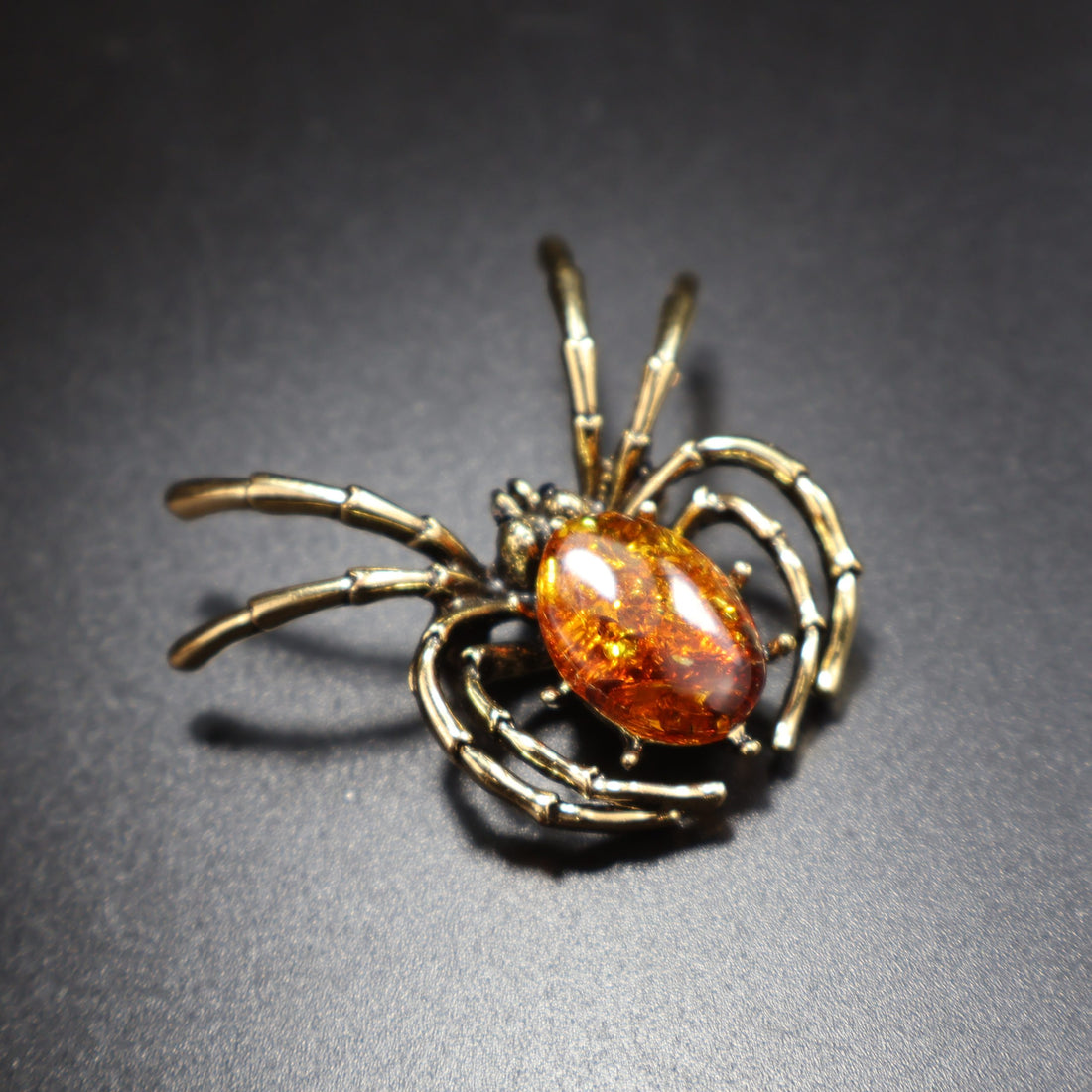 Handmade Baltic amber spider brooch by KIZIMA® — natural amber unisex jewelry, made in USA