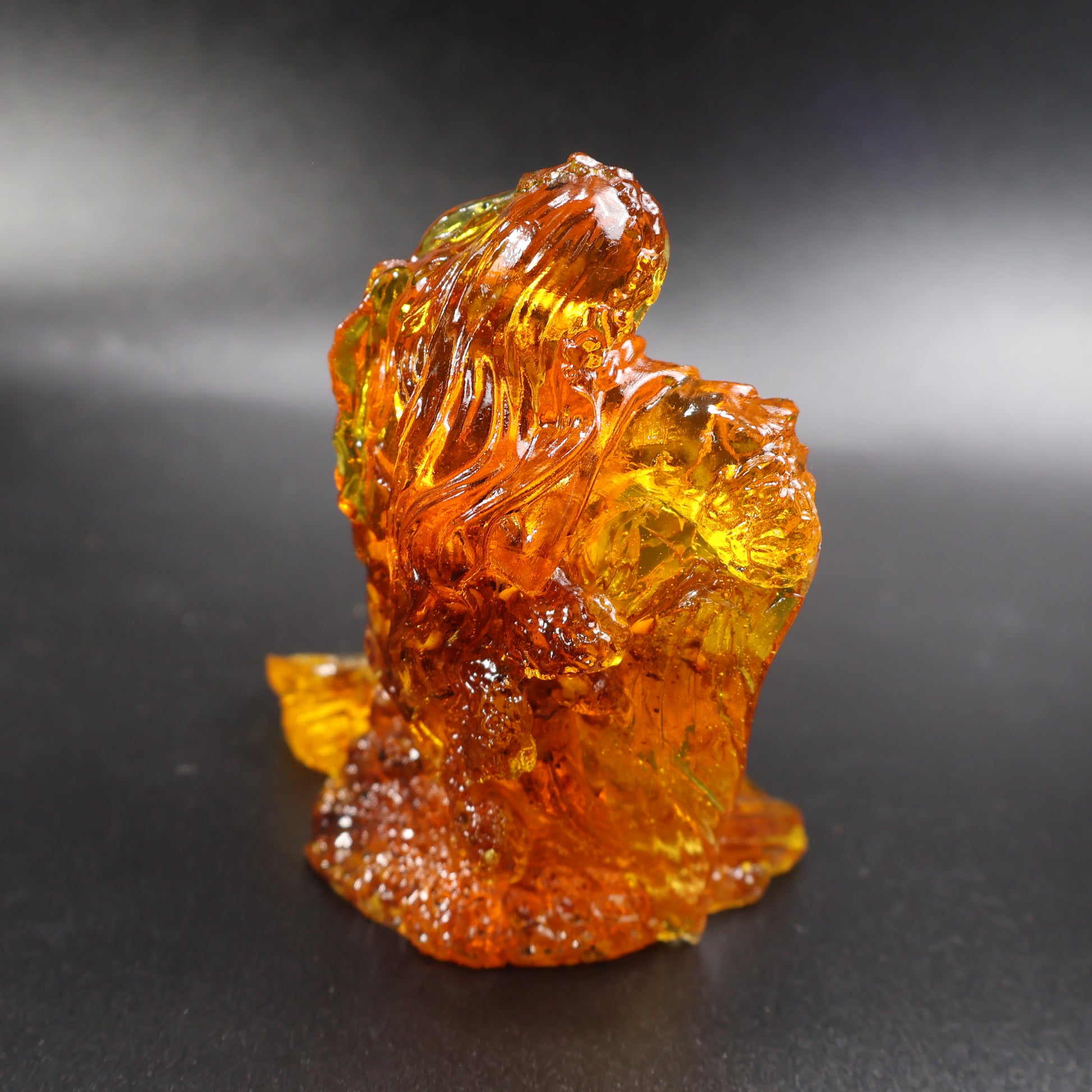 Baltic amber mermaid figurine side view showing natural amber grain