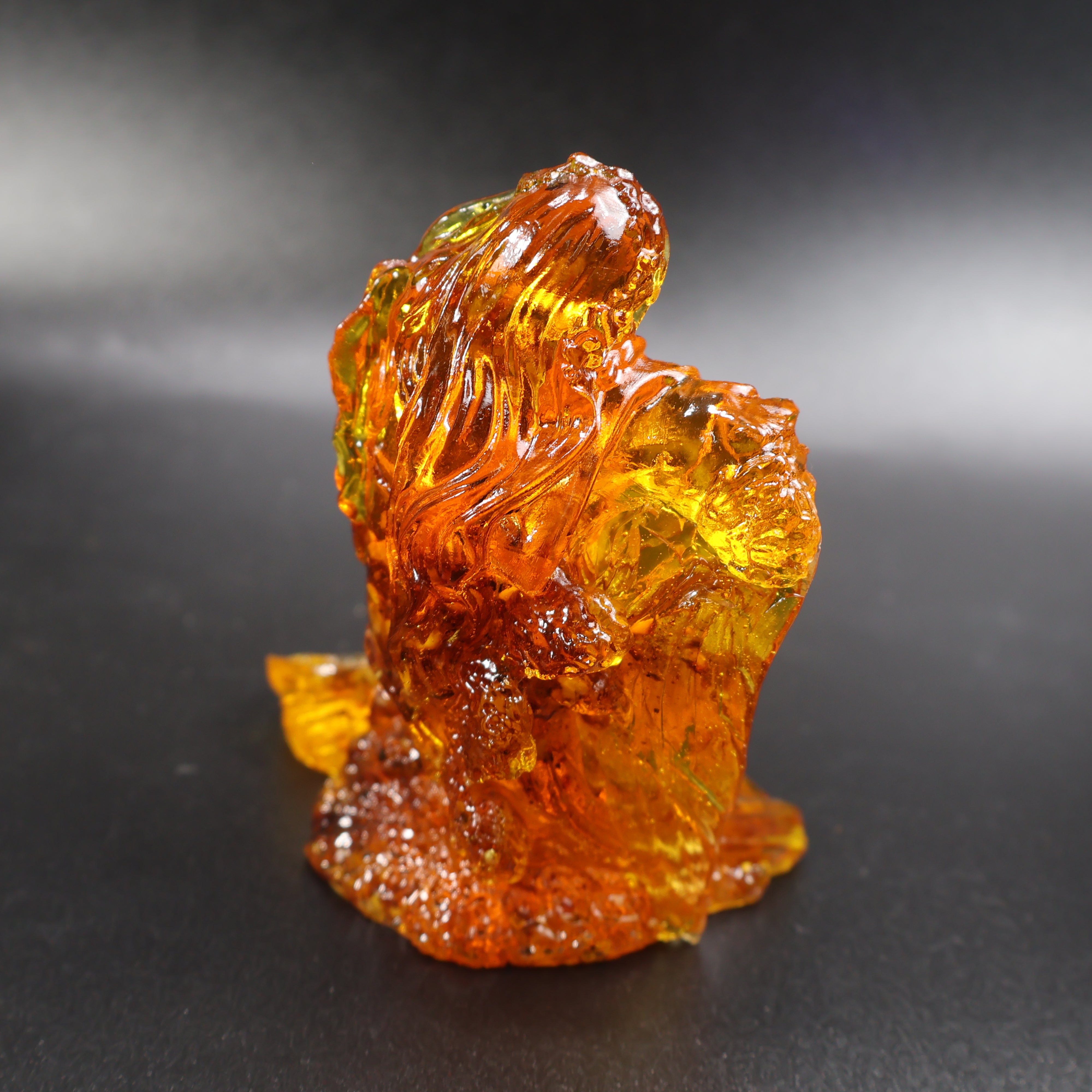 Baltic amber mermaid figurine side view showing natural amber grain
