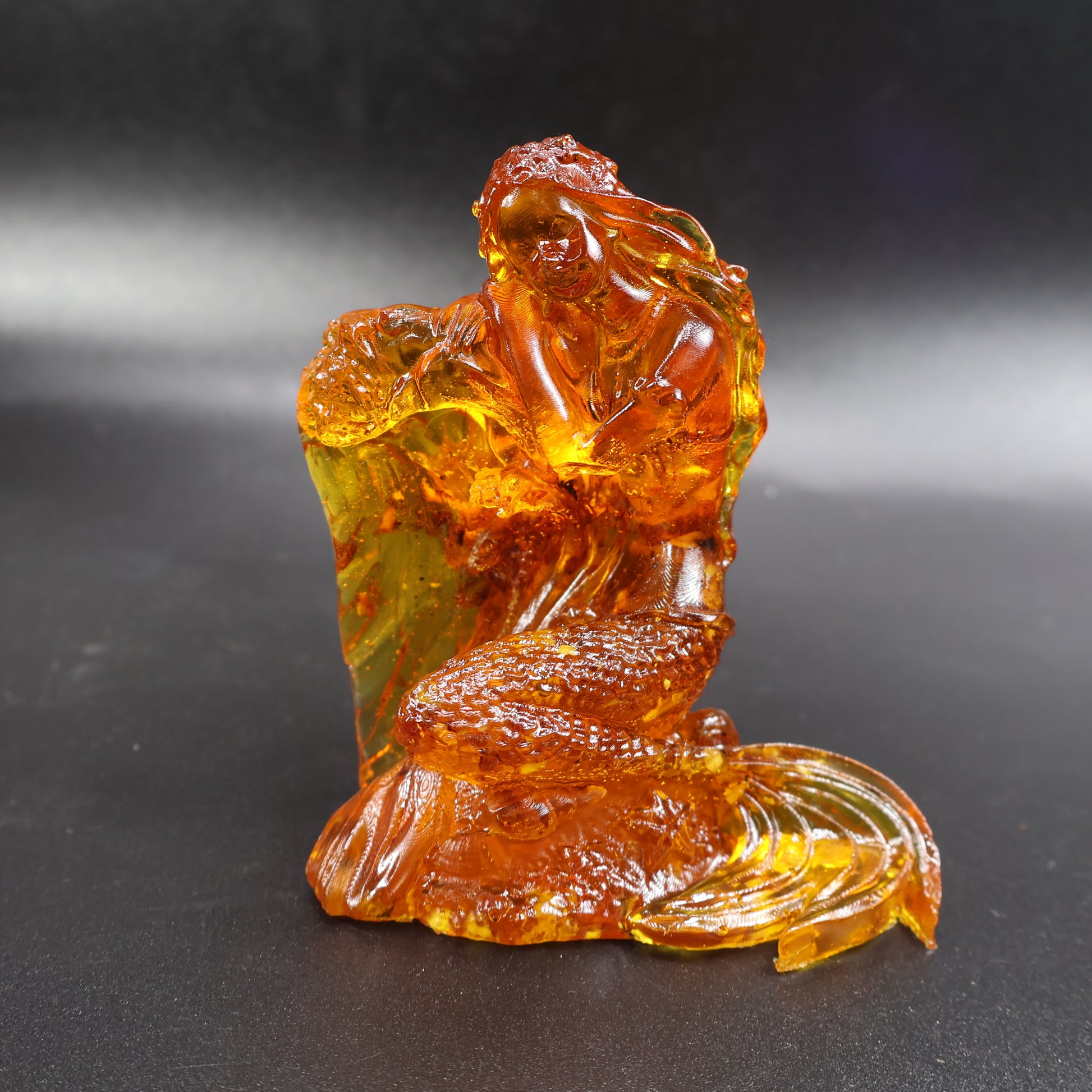 Natural Baltic amber mermaid statue back view, handmade in Brooklyn NY