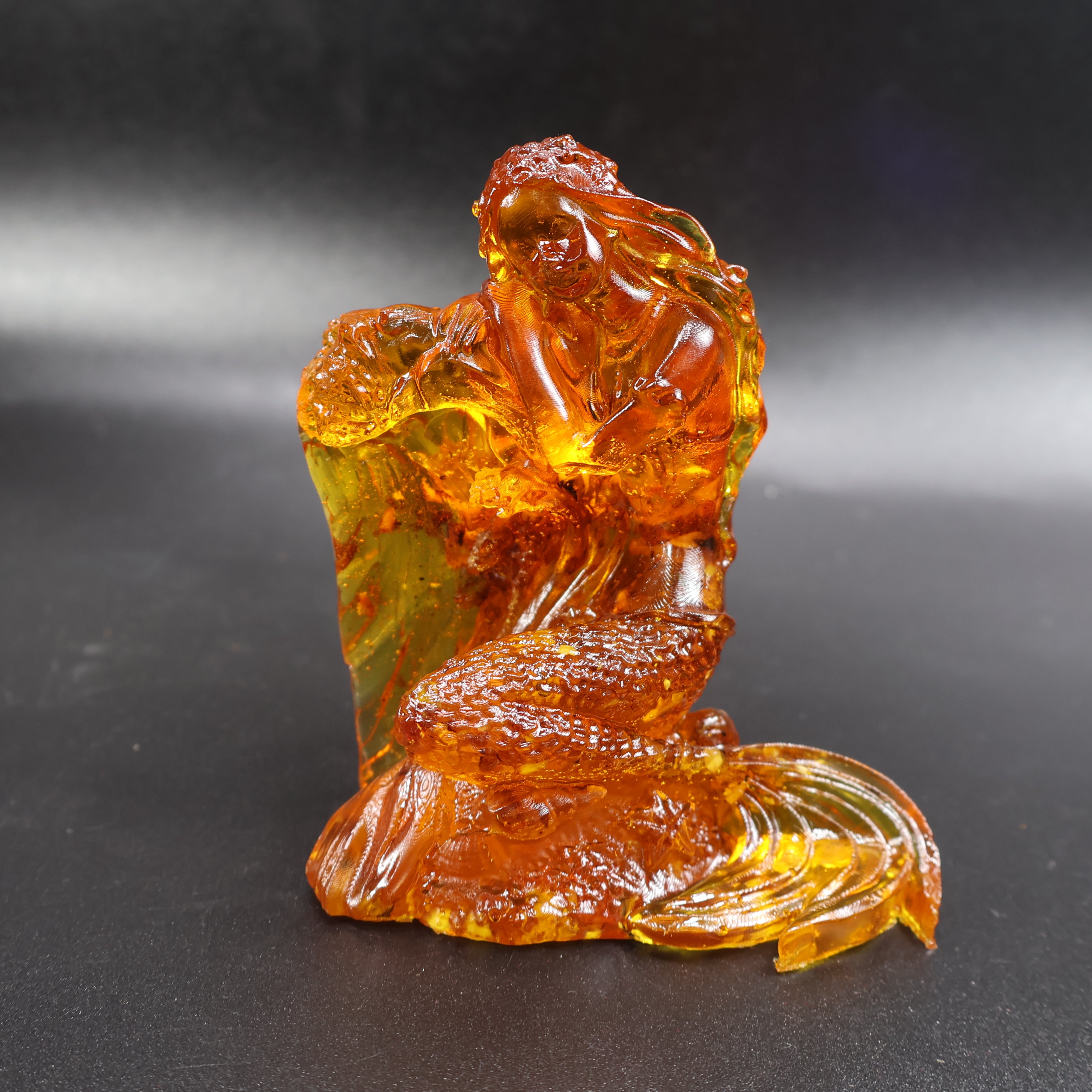 Natural Baltic amber mermaid statue back view, handmade in Brooklyn NY