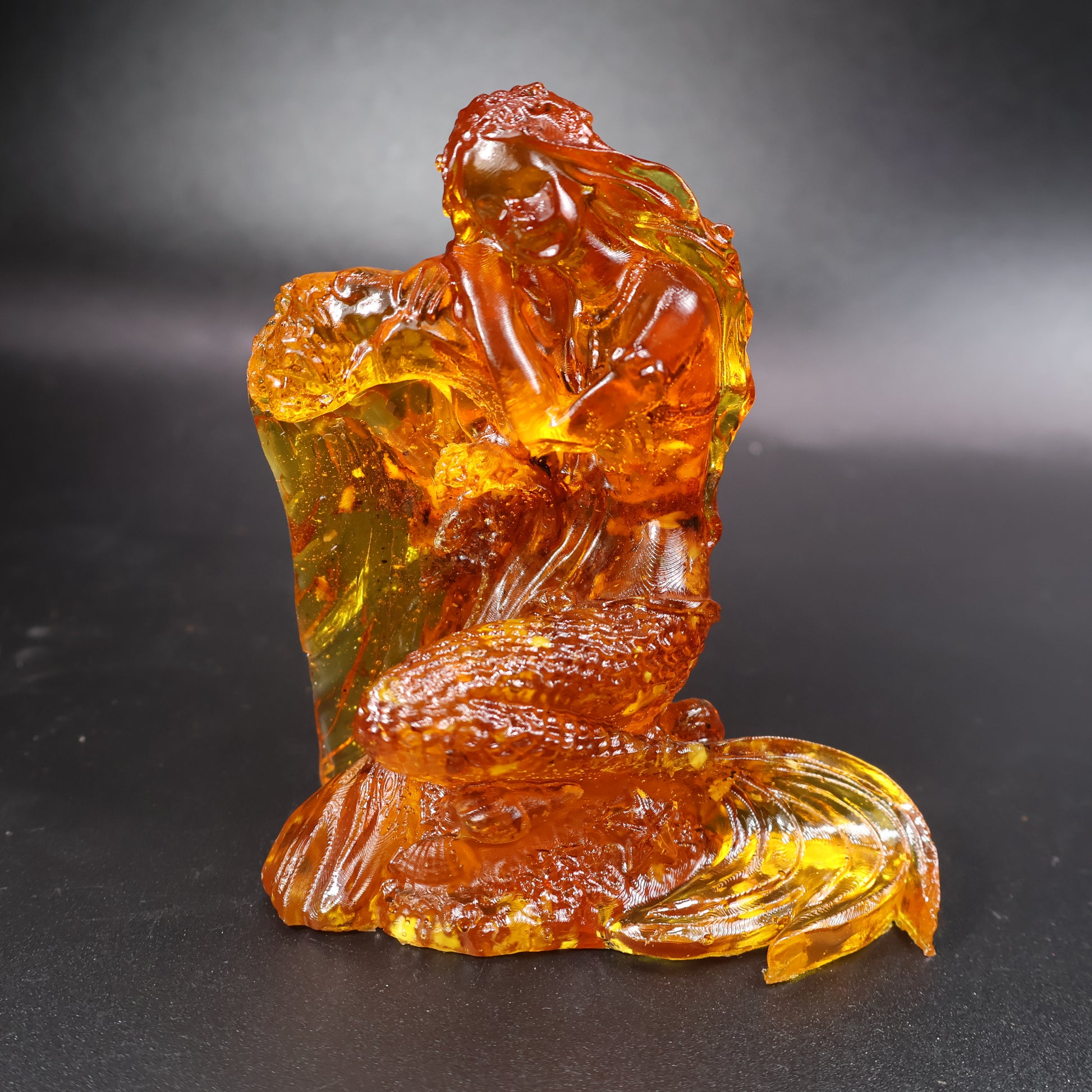 Baltic amber mermaid figurine displayed in KIZIMA® gift packaging