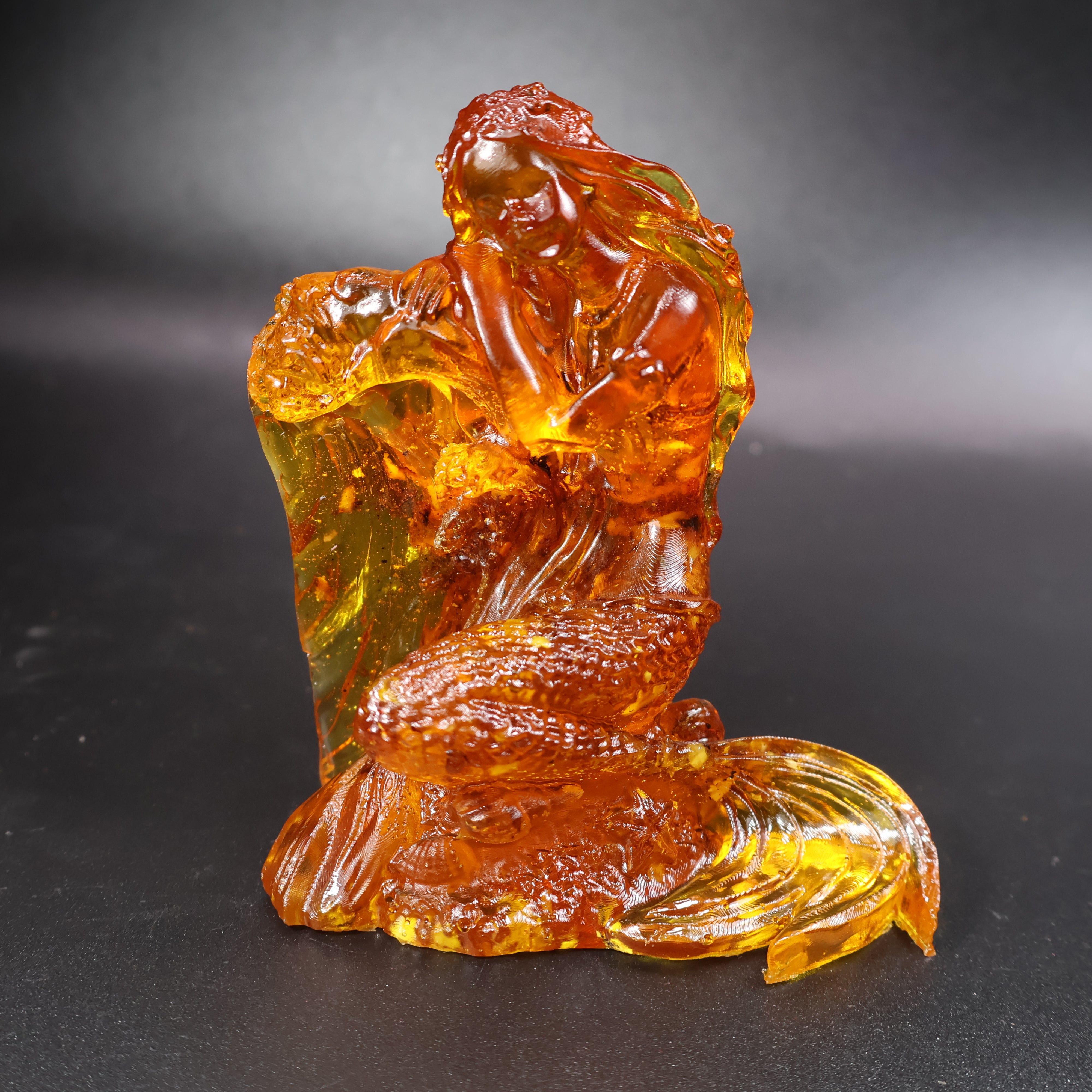 Baltic amber mermaid figurine displayed in KIZIMA® gift packaging