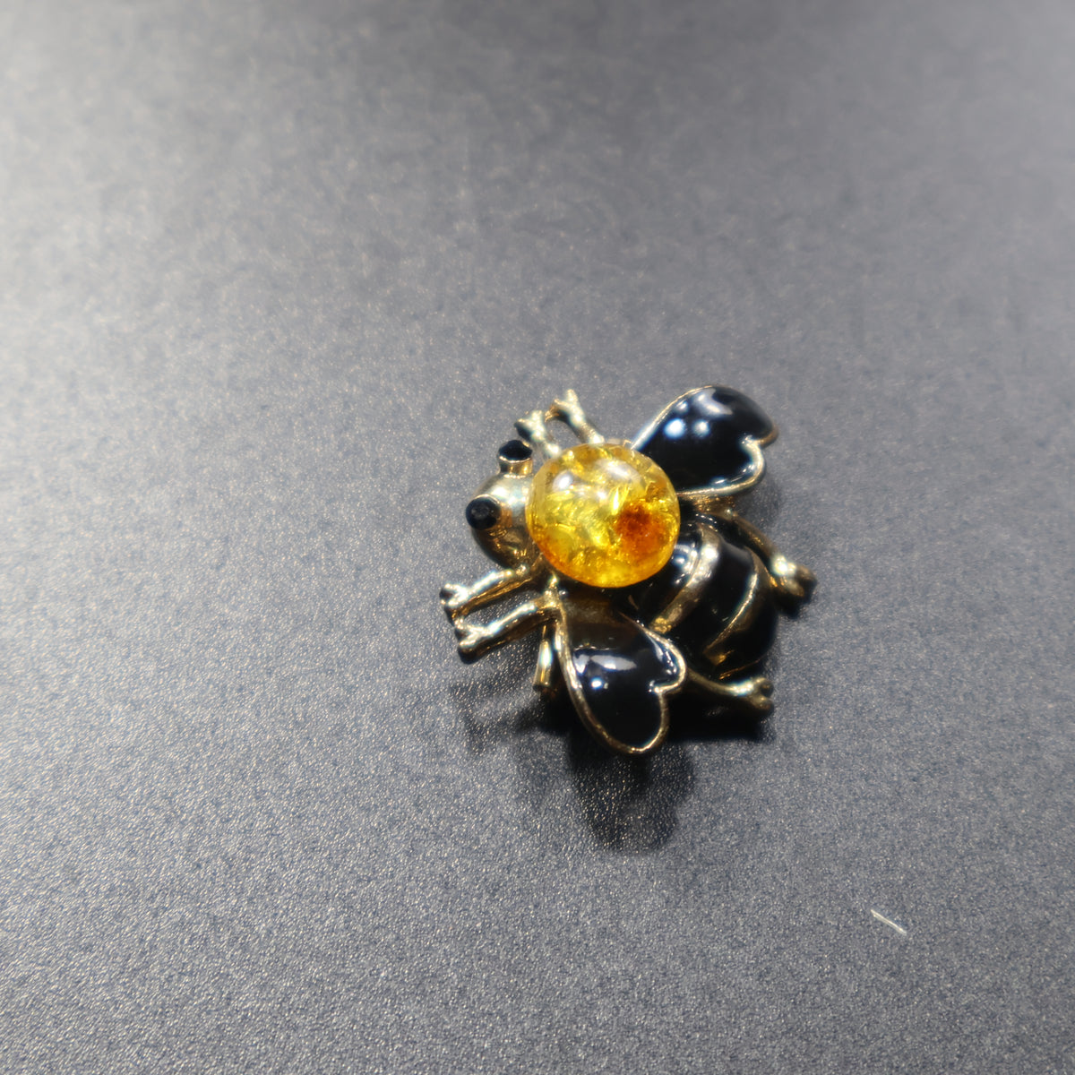Made in USA Genuine Natural Baltic Amber Bee Brooch by KIZIMA® — handmade amber jewelry, top view