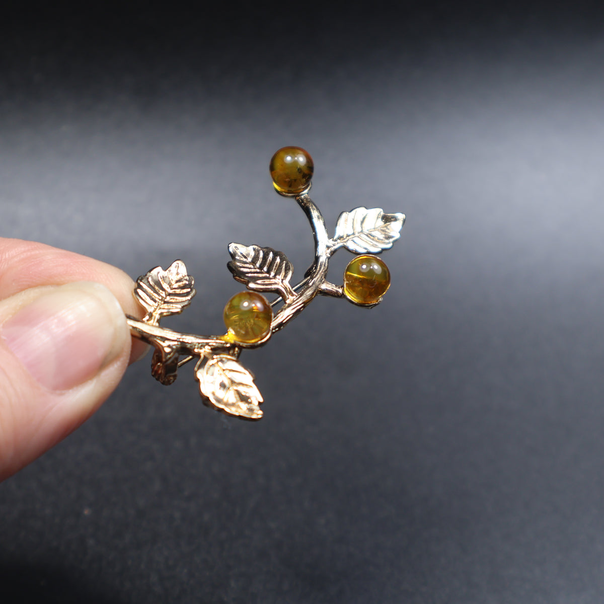 Made in USA Genuine Natural Baltic Amber Brooch Gift by KIZIMA® — handmade amber jewelry, angled view