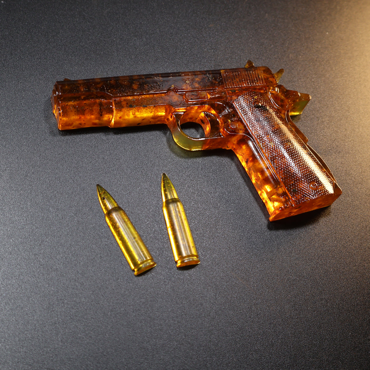 Made in USA Natural Baltic Amber Gun Figurine, Collectible Decor by KIZIMA® — handmade amber pistol sculpture, final view