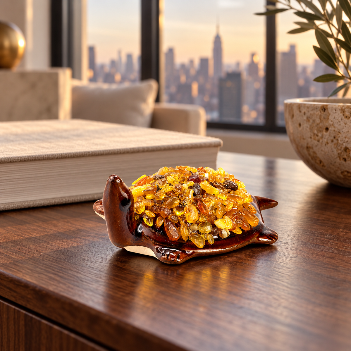 KIZIMA 10N0050q21 small Baltic amber turtle figurine on a walnut console in a warm New York apartment interior.
