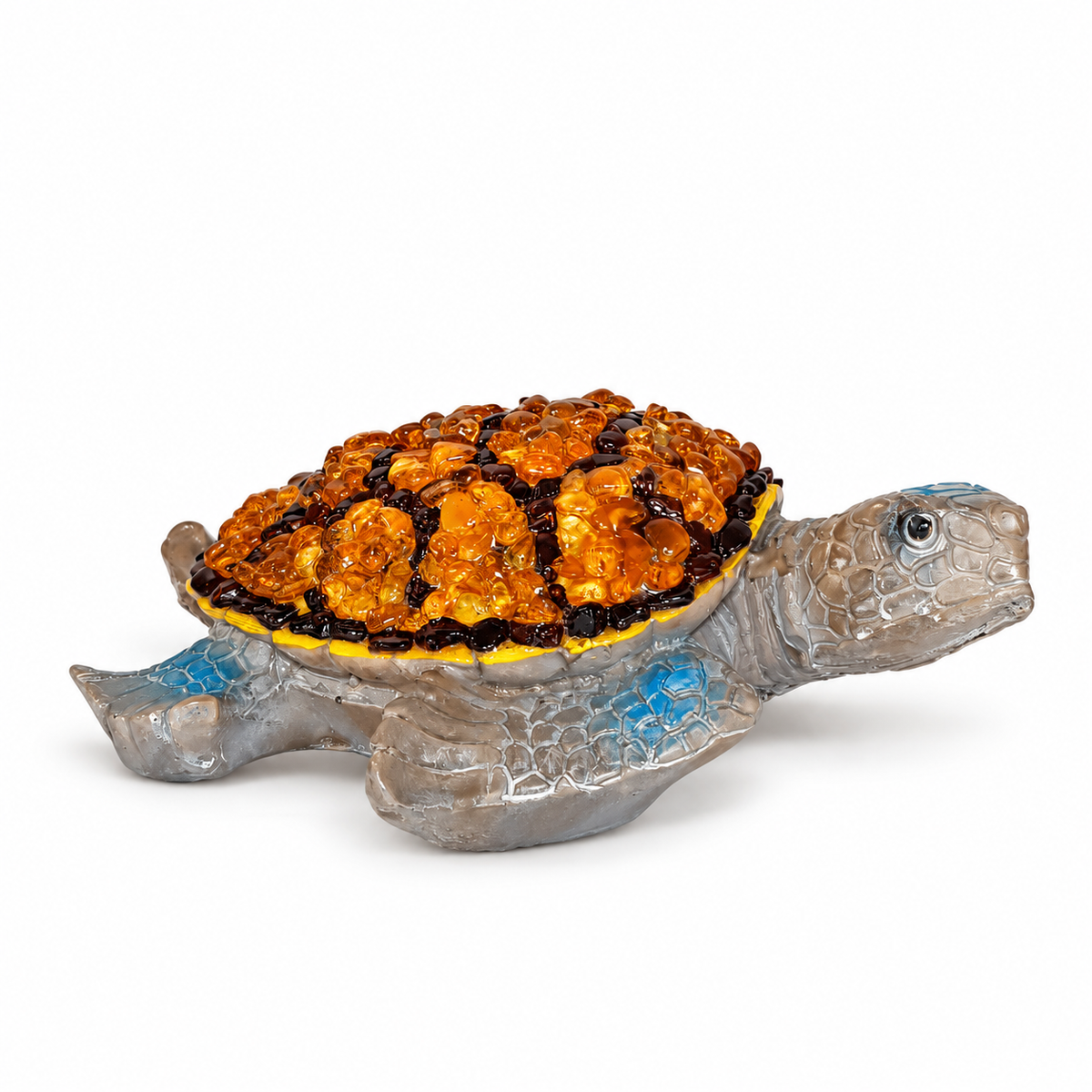 KIZIMA 5599170T Baltic amber turtle figurine on a white studio background, showing the grey sea-turtle body, blue accents and amber mosaic shell.