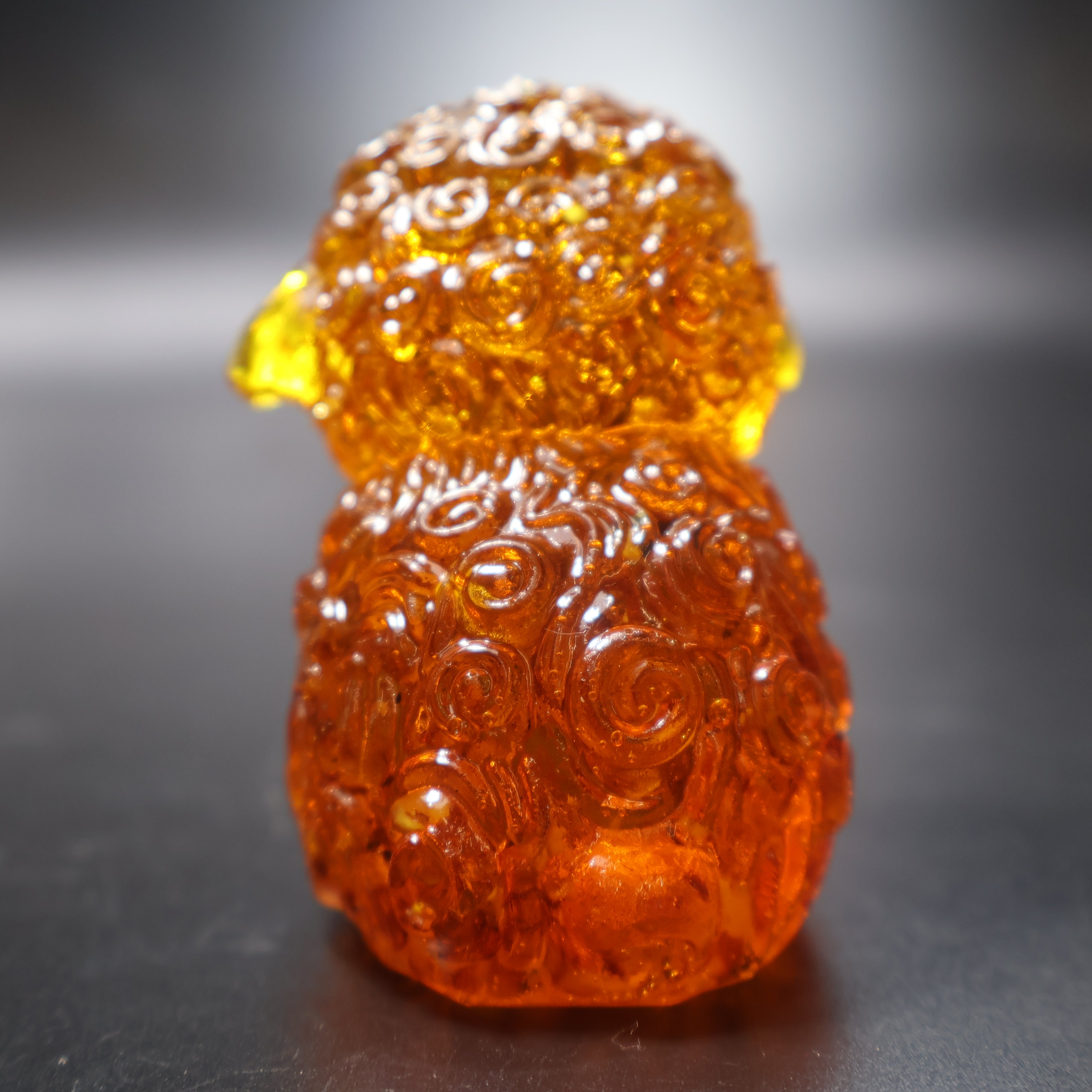 Handcrafted amber sheep figurine honey Baltic amber close up