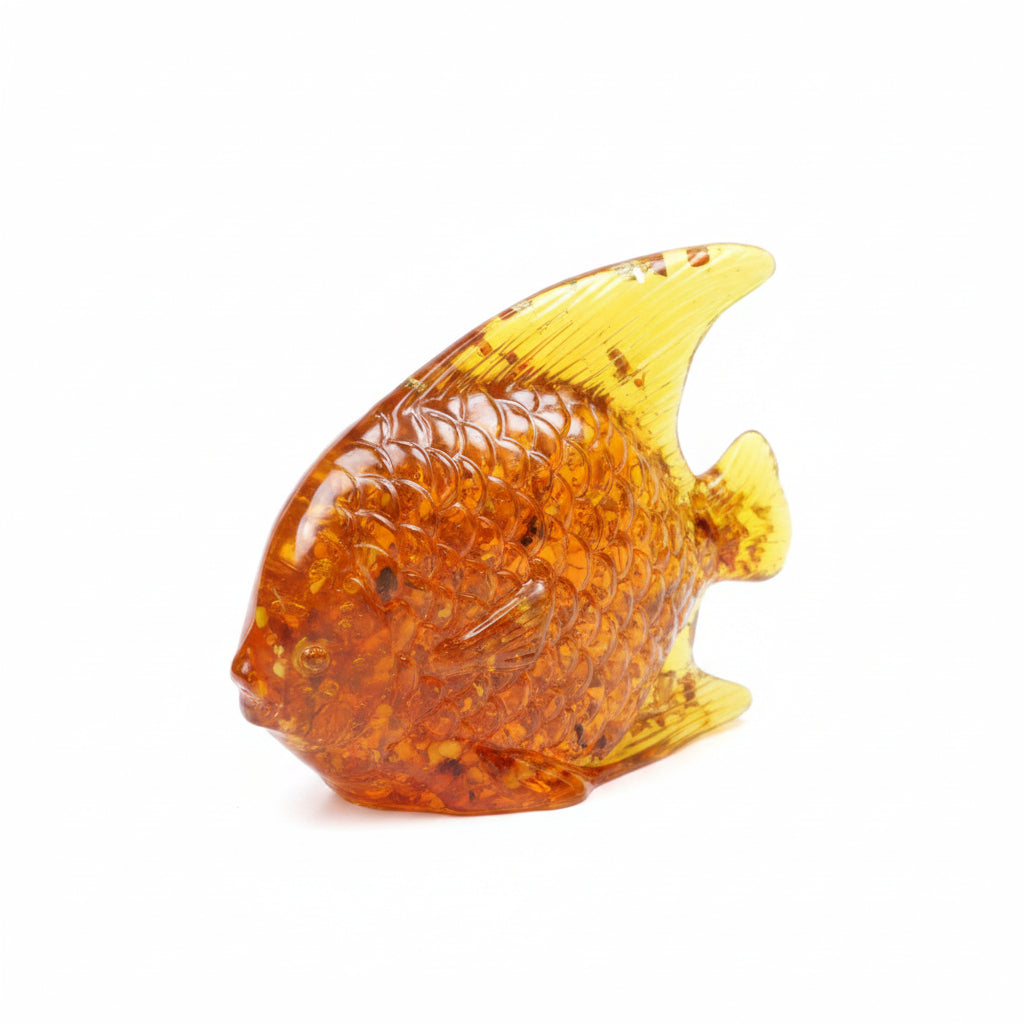 Handmade Baltic amber fish sculpture isolated on white background luxury fisherman gift decor