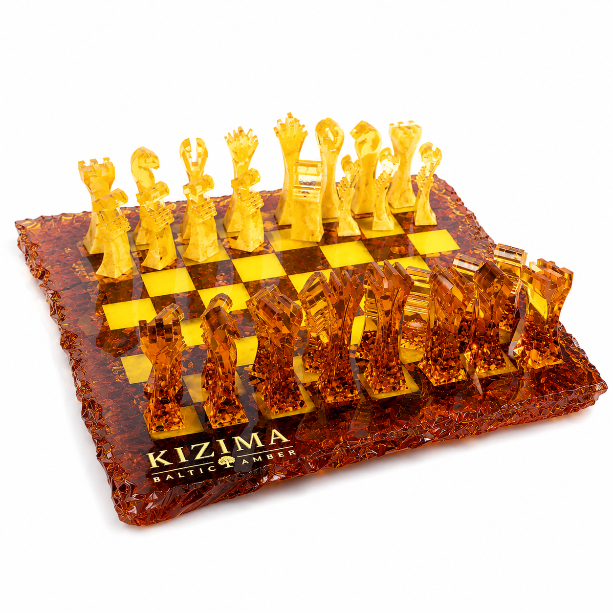 KIZIMA® handcrafted Baltic amber chess set isolated on white background with sculptural modern chess pieces and artistic irregular amber board design.