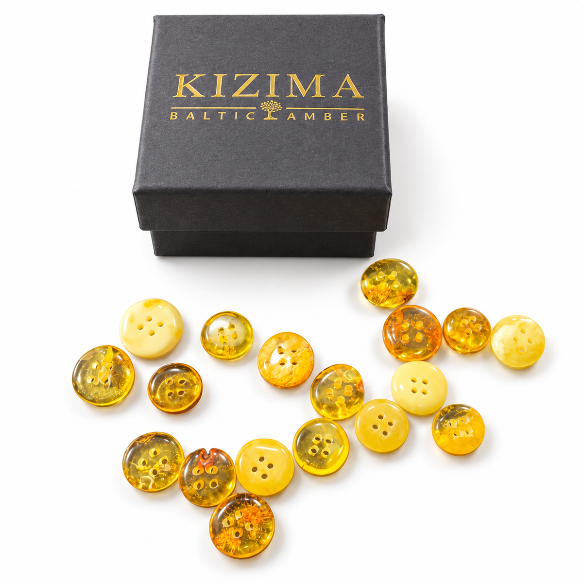 Assorted Made in USA Natural Baltic Amber four-hole buttons by KIZIMA® beside the KIZIMA® gift box; one random-color button supplied
