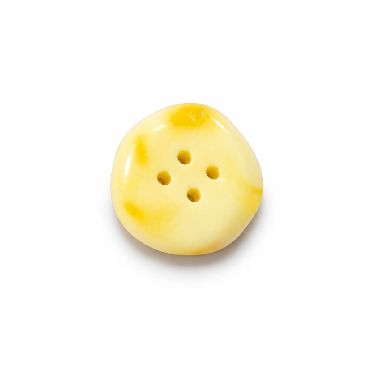 Made in USA Natural Baltic Amber four-hole sewing button by KIZIMA®, creamy yellow, on white; random color supplied
