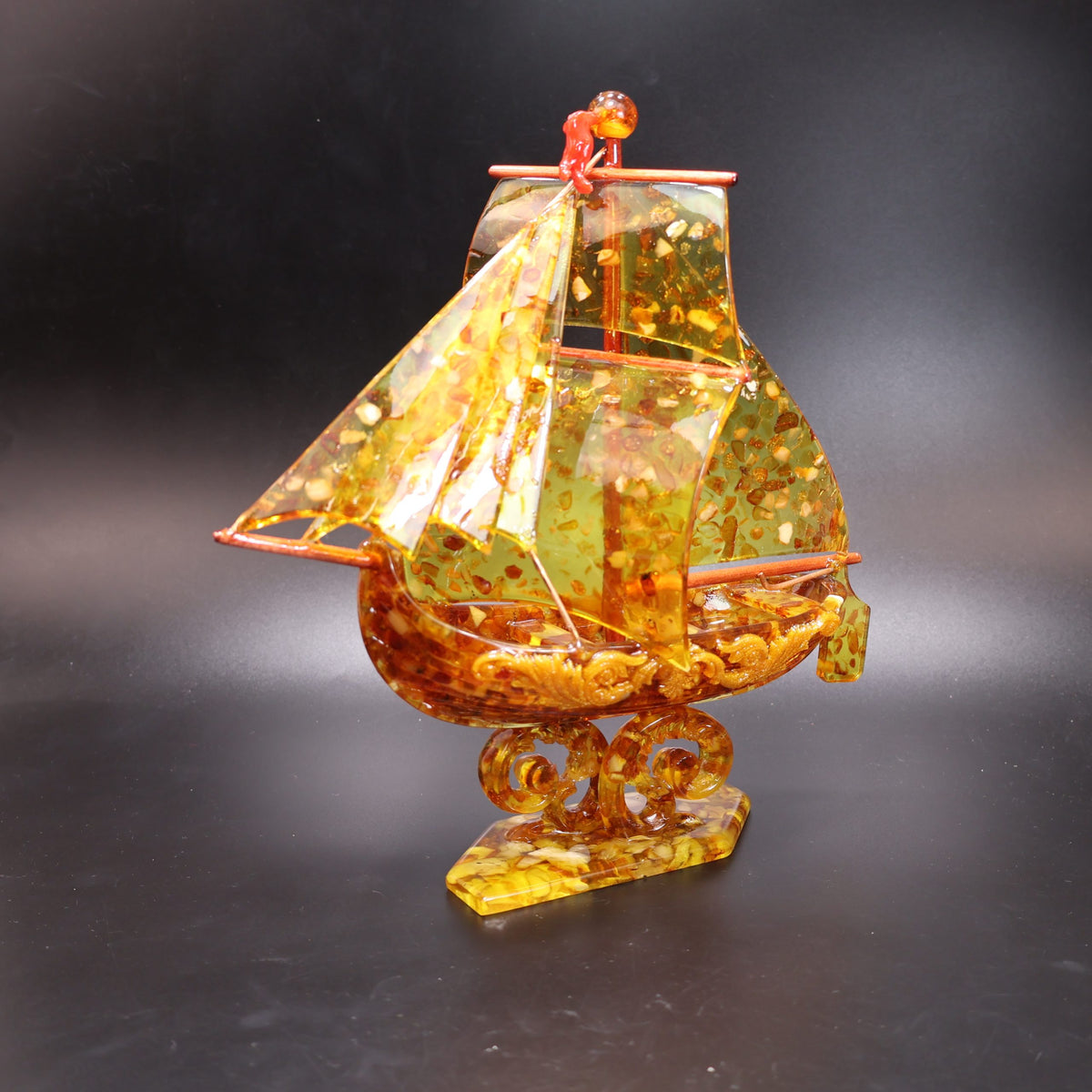 Baltic amber galleon sculpture, side view of the hull — one-of-a-kind retirement gift for a ship captain