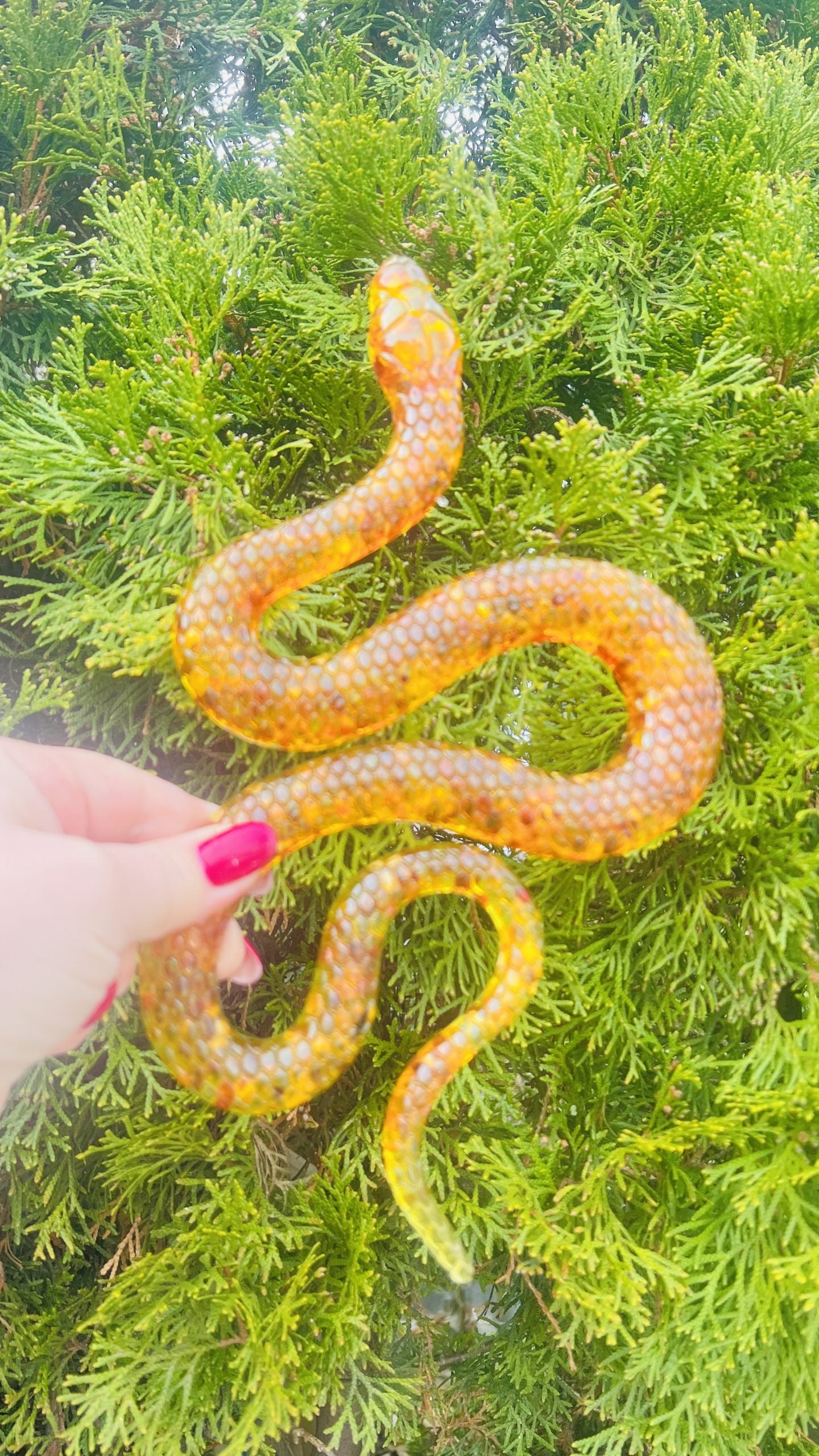 Handmade Baltic amber magical snake by KIZIMA® USA — natural amber decor, side view
