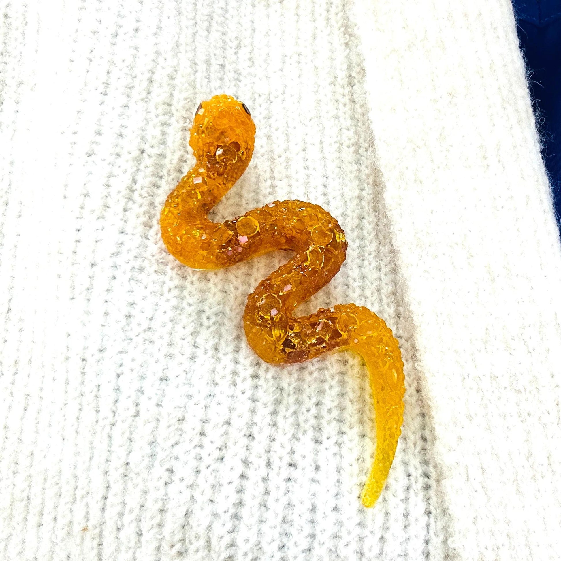 Handmade Baltic amber snake brooch by KIZIMA® USA — natural amber jewelry, close-up