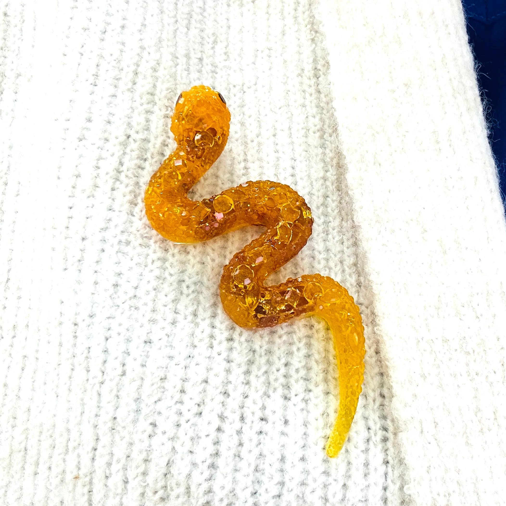 Handmade Baltic amber snake brooch by KIZIMA® USA — natural amber jewelry, close-up