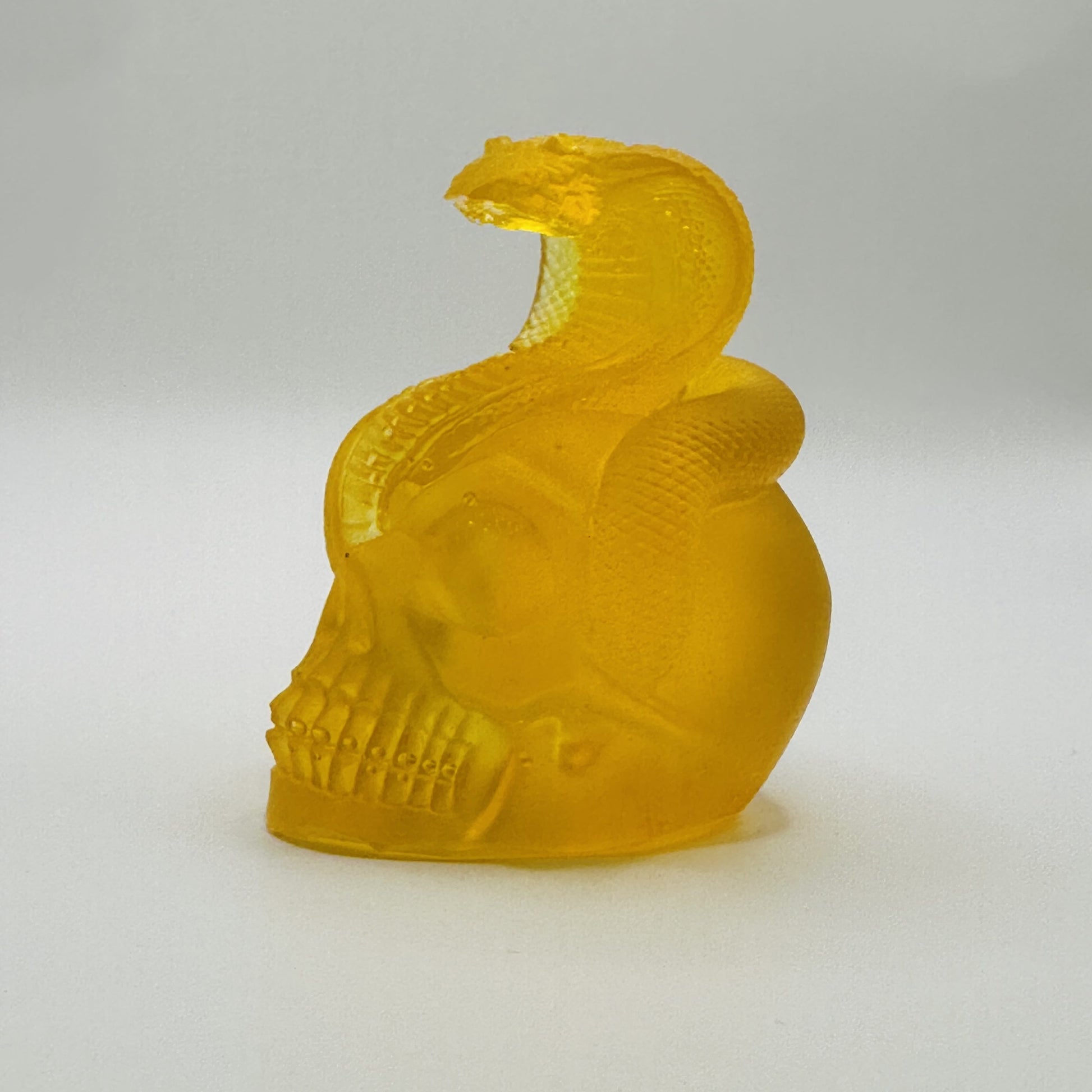 Handmade Baltic amber snake skull by KIZIMA® USA — natural amber gift, close-up