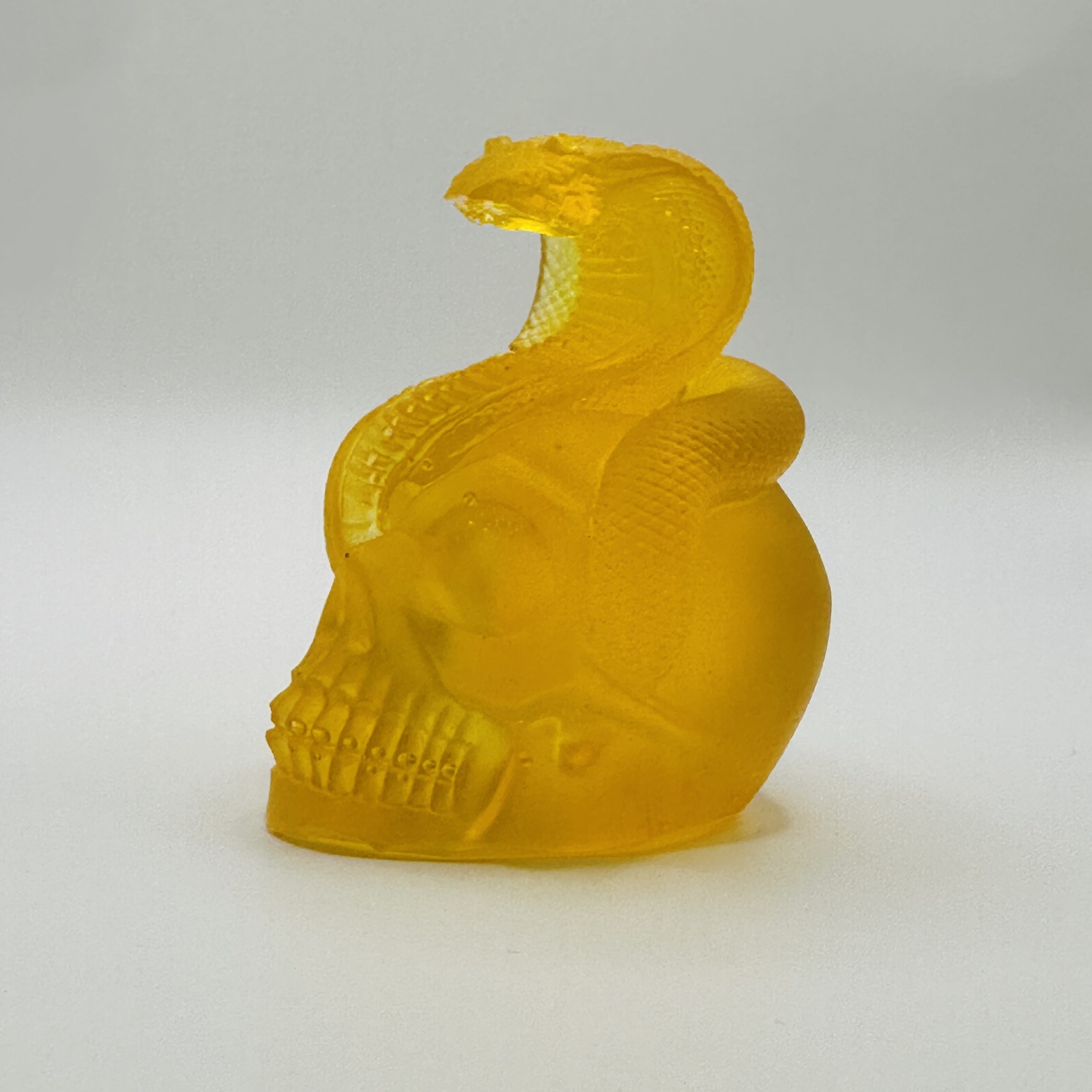 Handmade Baltic amber snake skull by KIZIMA® USA — natural amber gift, close-up