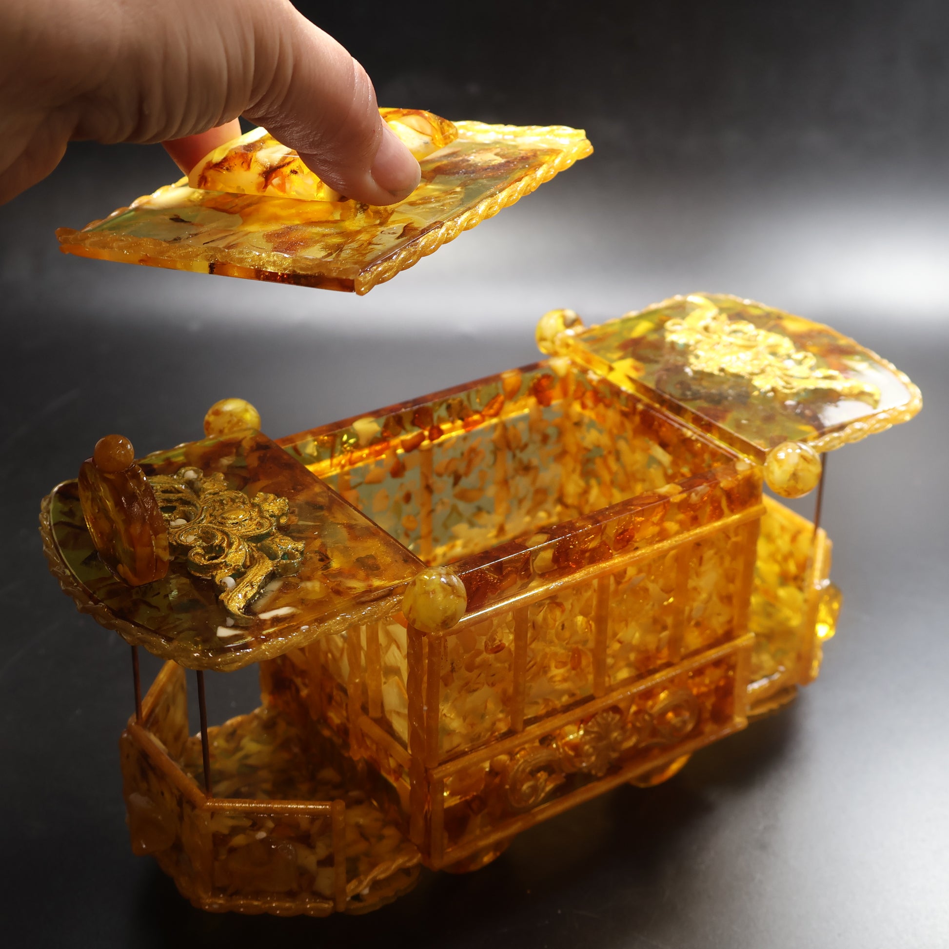 Close-up of open Natural Baltic Amber tram keepsake box interior compartment for rings and small jewelry