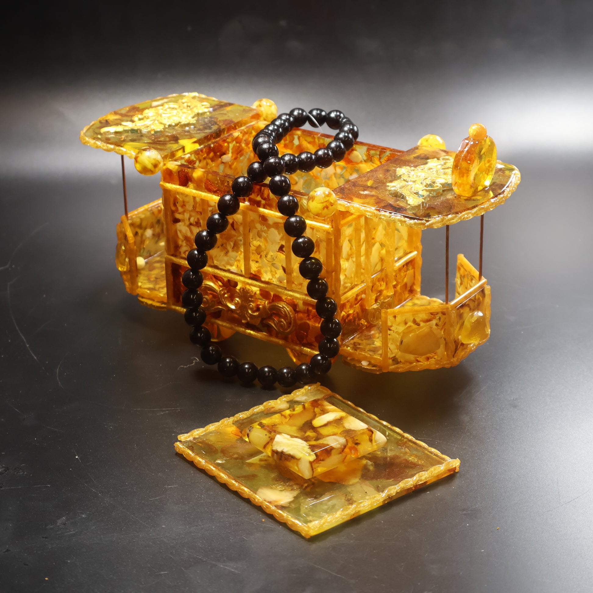 Baltic Amber vintage tram jewelry box with roof lid open revealing interior jewelry storage compartment